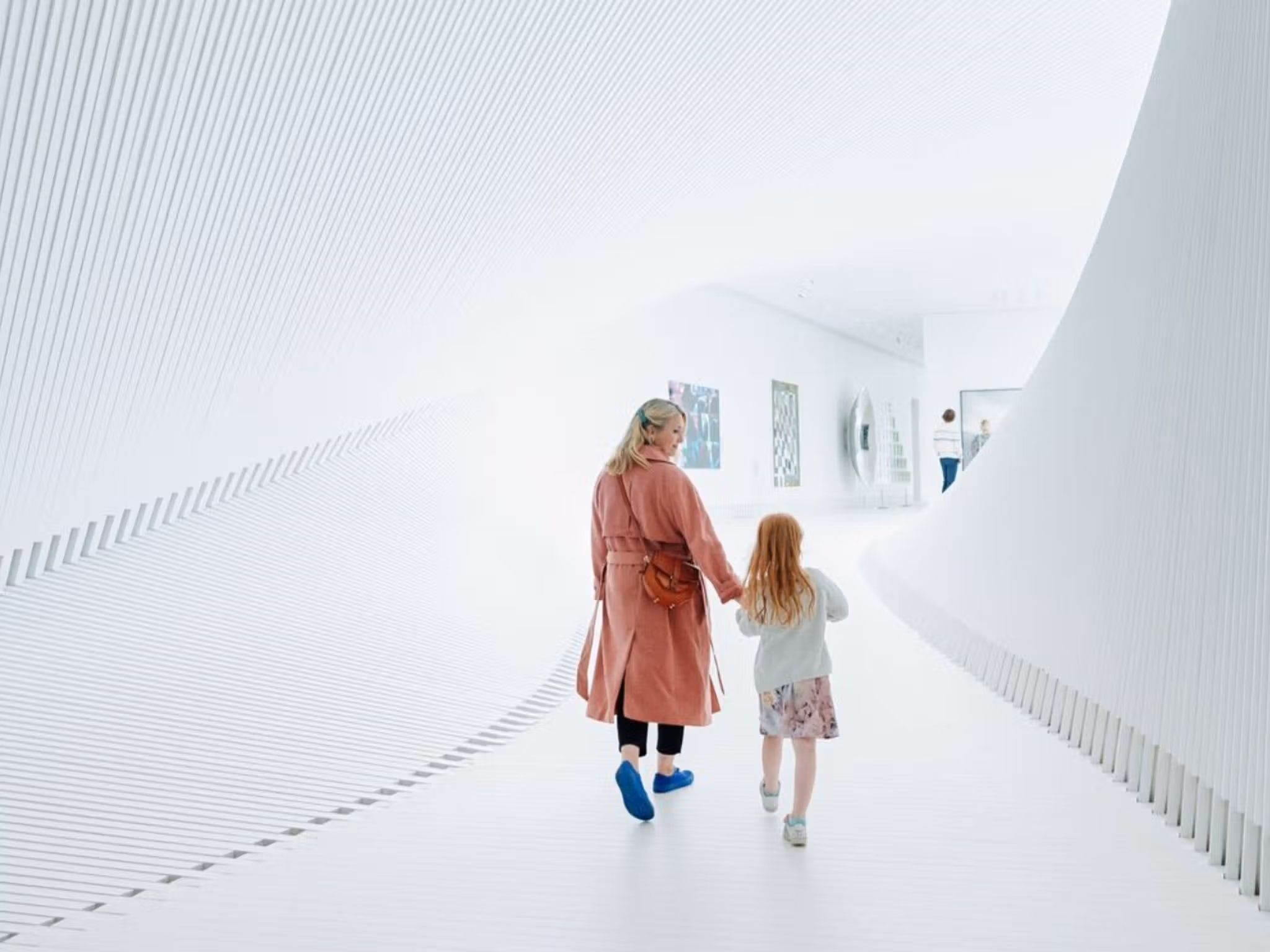 Mother and child walking inside The Twist at Kistefos, Hadeland