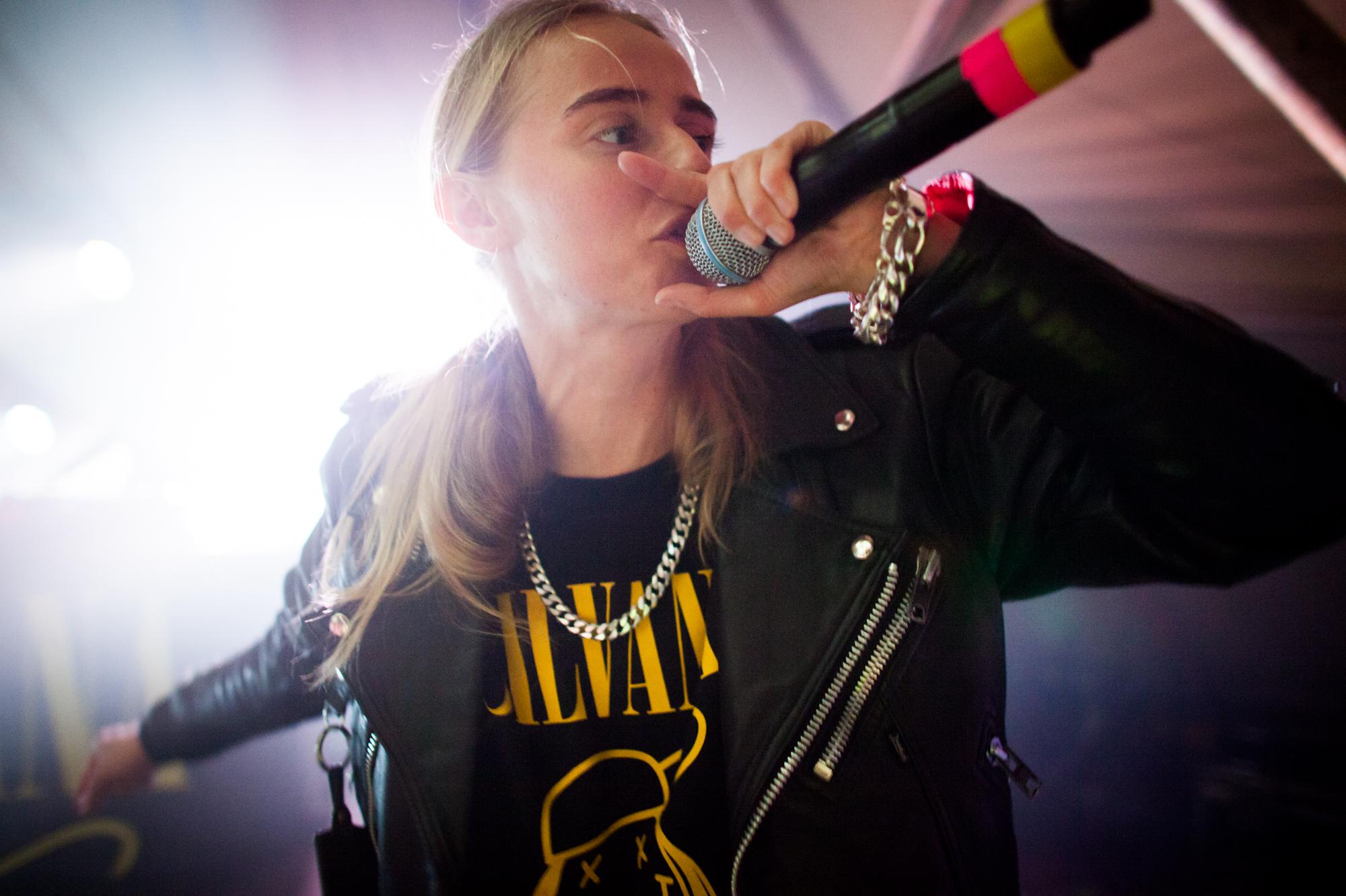 Close-up image of a singer with a Nirvana T-shirt
