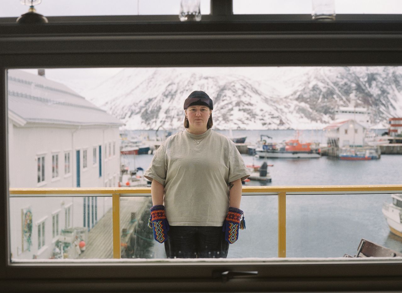 A sami woman in a snow covered harbour