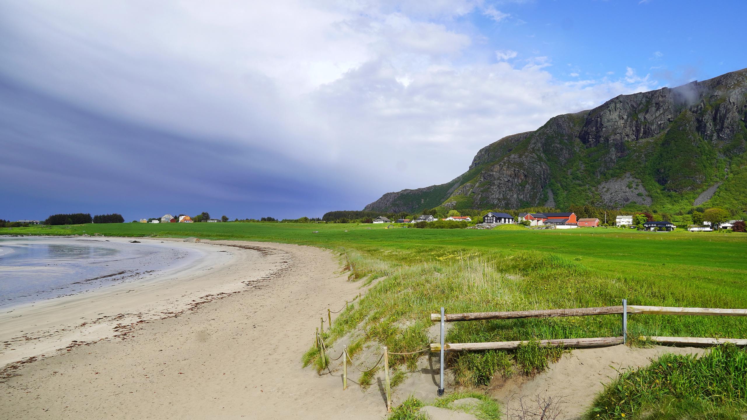 Farstadsanden golden beach and mountains behind.