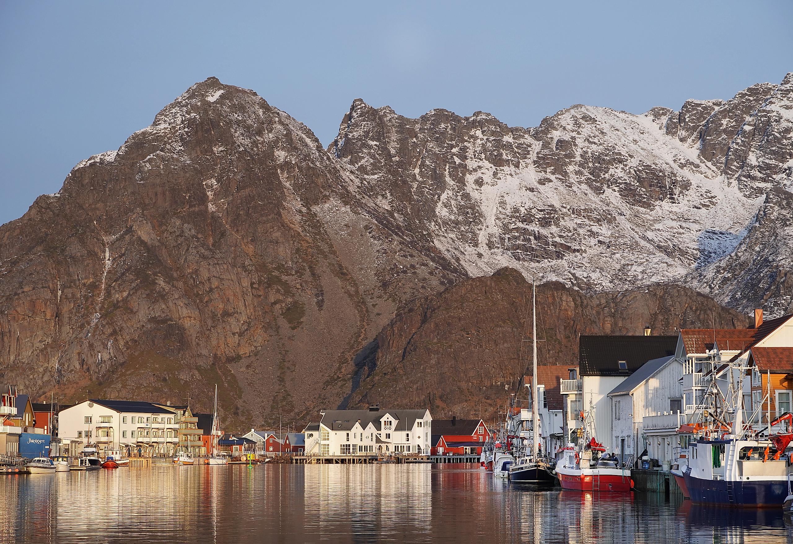 Fishing village at the foot of a big mountain.
