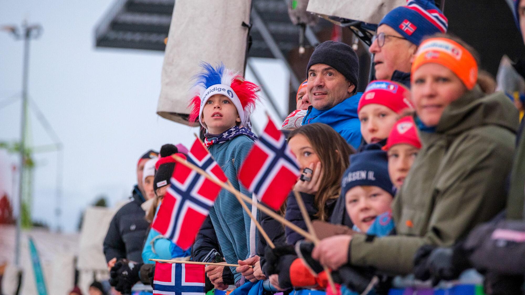People watching skiing from the stands.