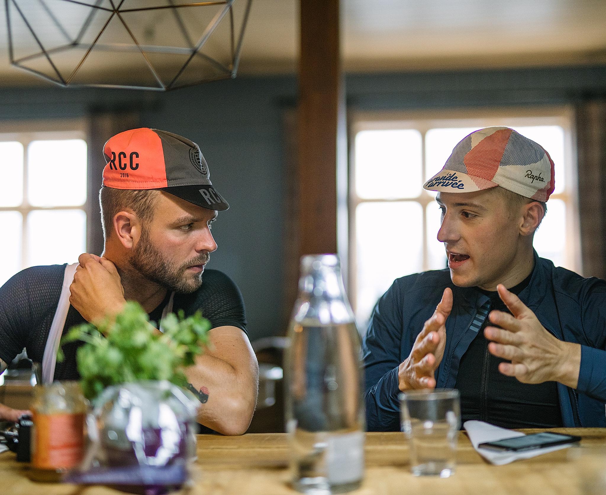 Two road cyclists on a break in a restaurant in Fjord Norway