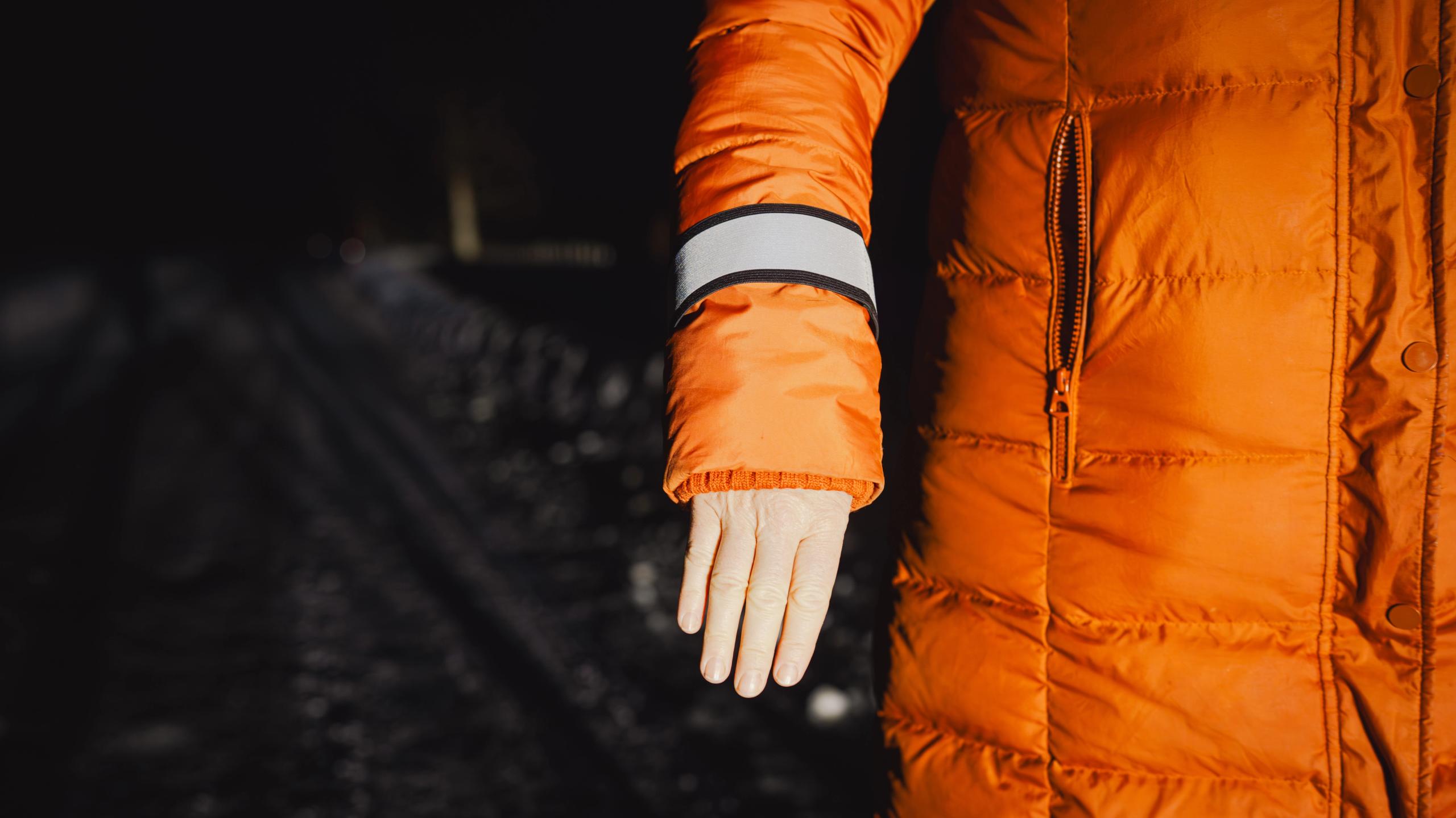 A hand with reflective gear.