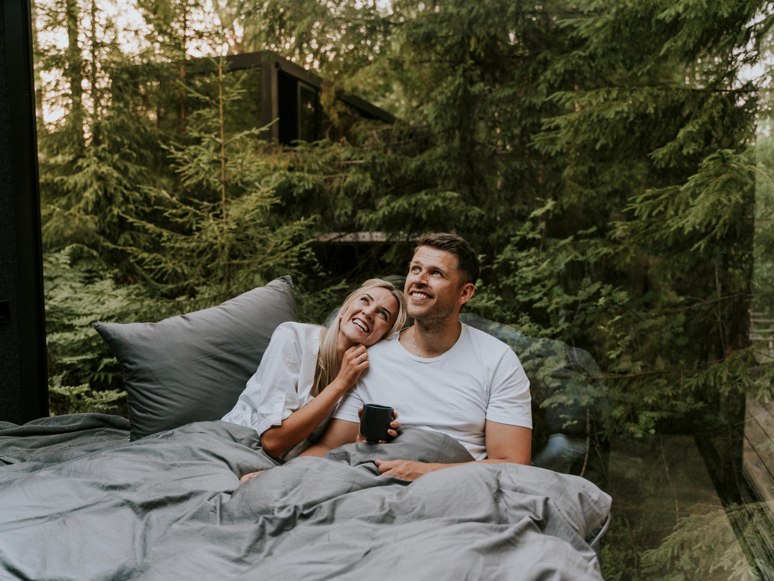 A man and a woman in bed at Laagen in Vestfold in Eastern Norway