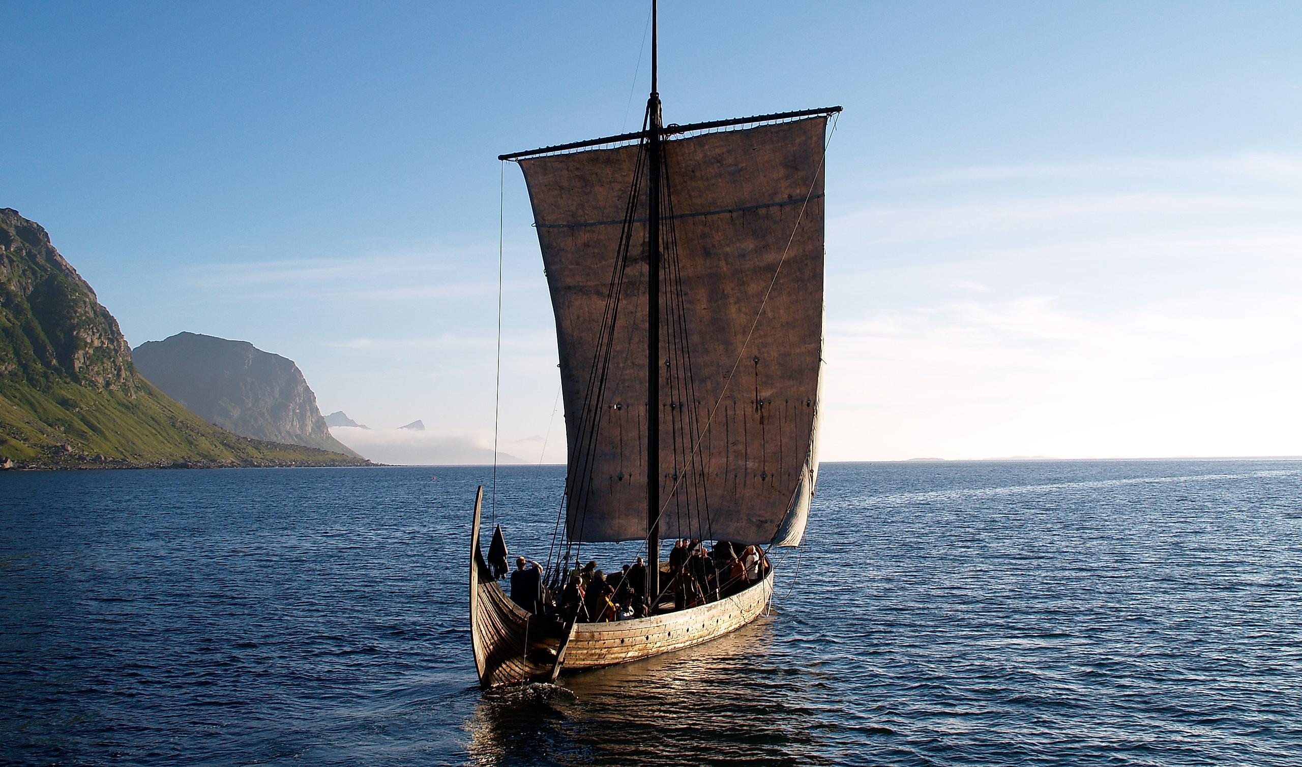 A Viking ship sailing on sea.