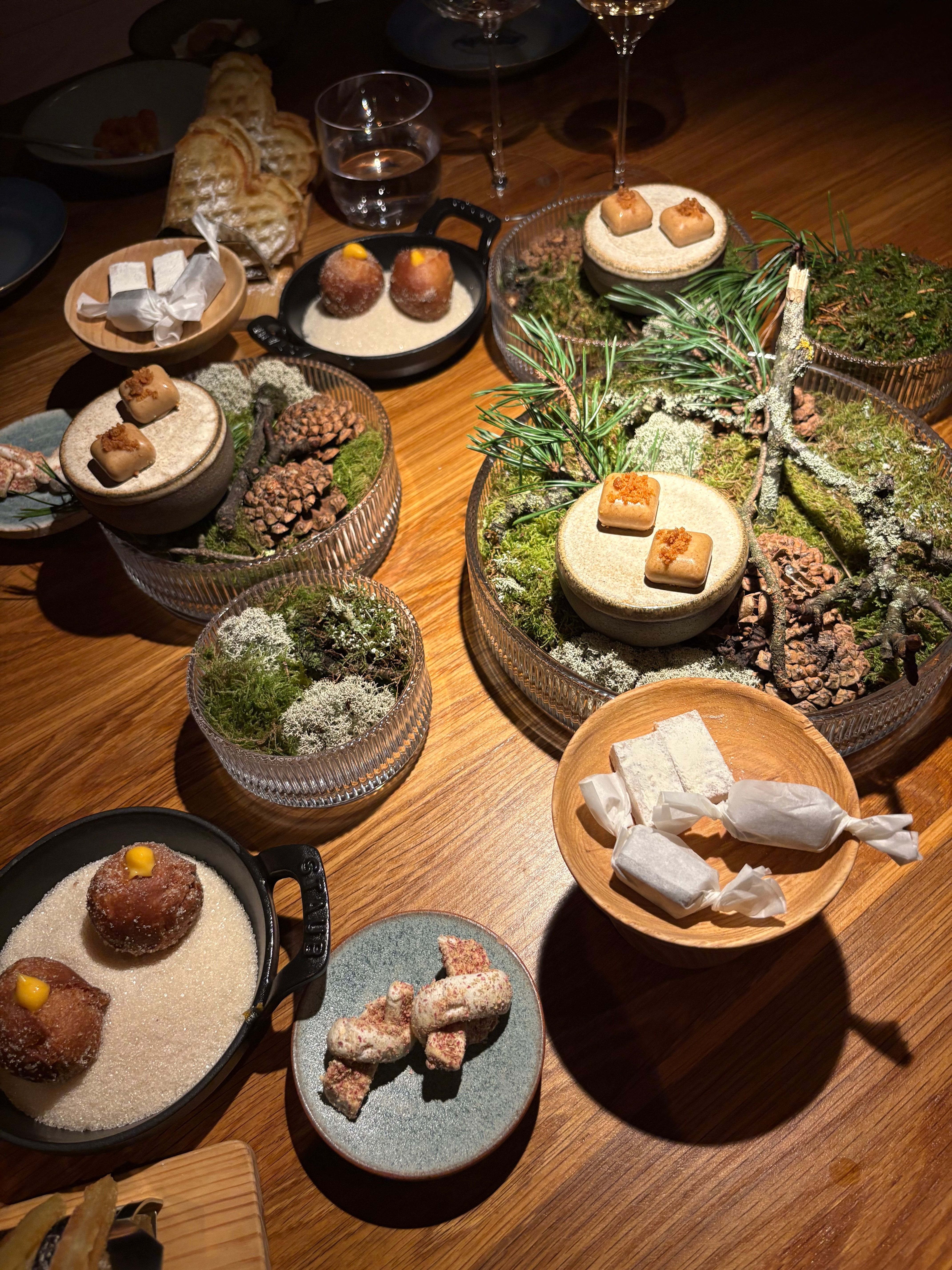A lot of small plates on a table at Credo restaurant in Oslo.