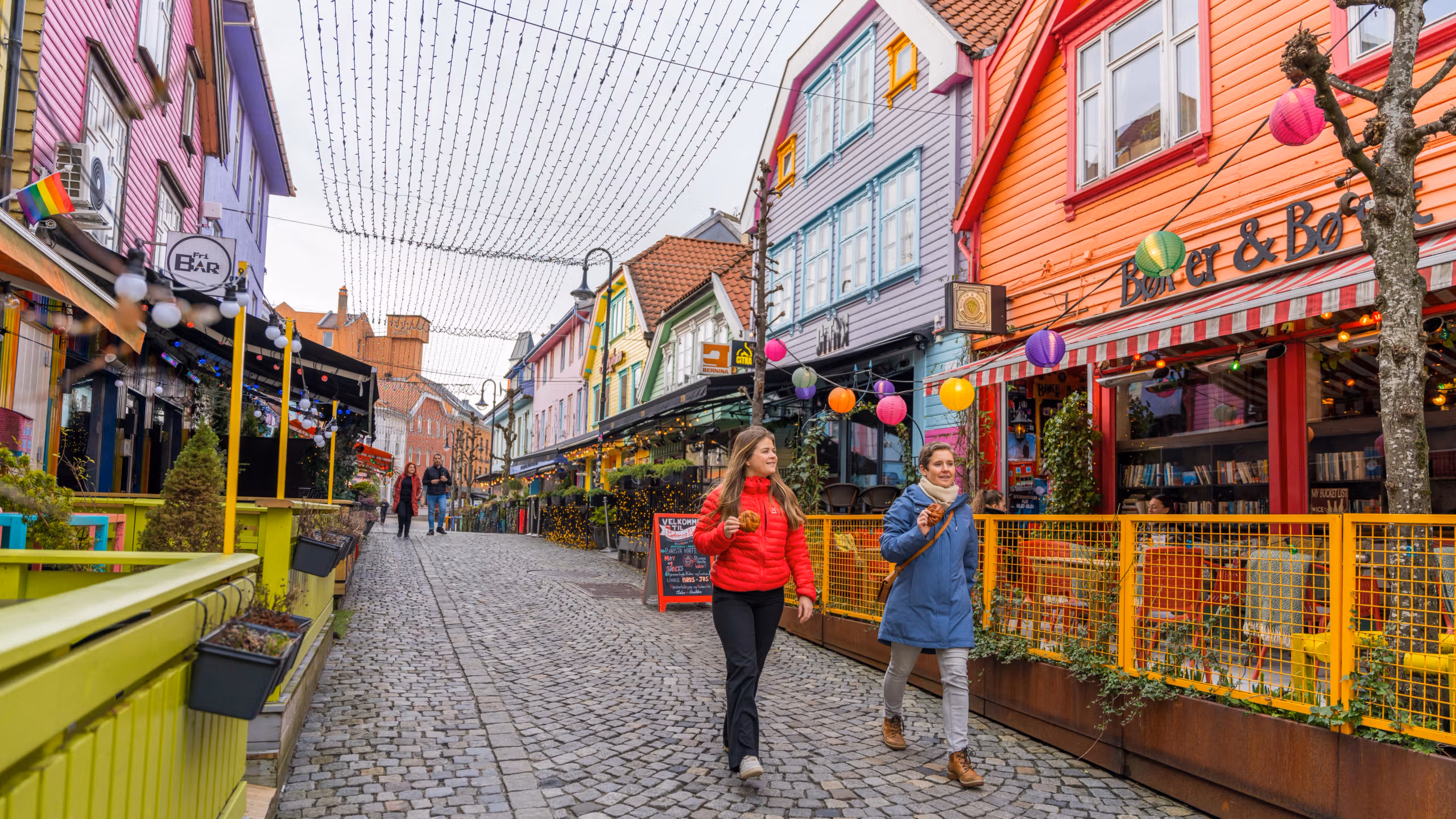 Two friends walking in Fargegaten, The colour street, in Stavanger