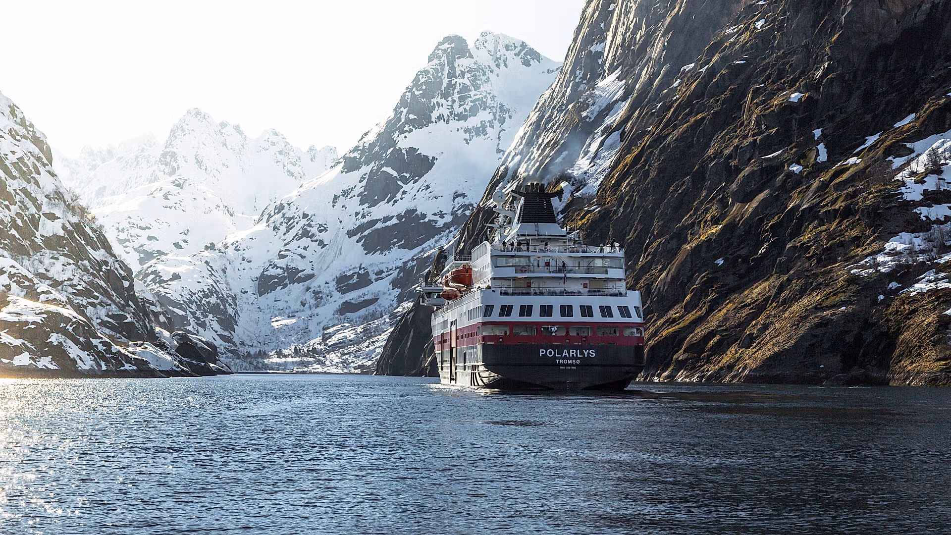 Hurtigruten between steep mountains