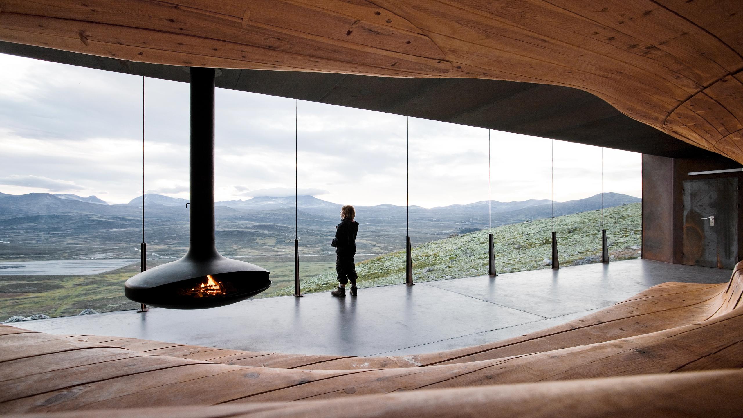 A woman enjoying the view from inside Viewpoint Snøhetta at Dovrefjell, Eastern Norway