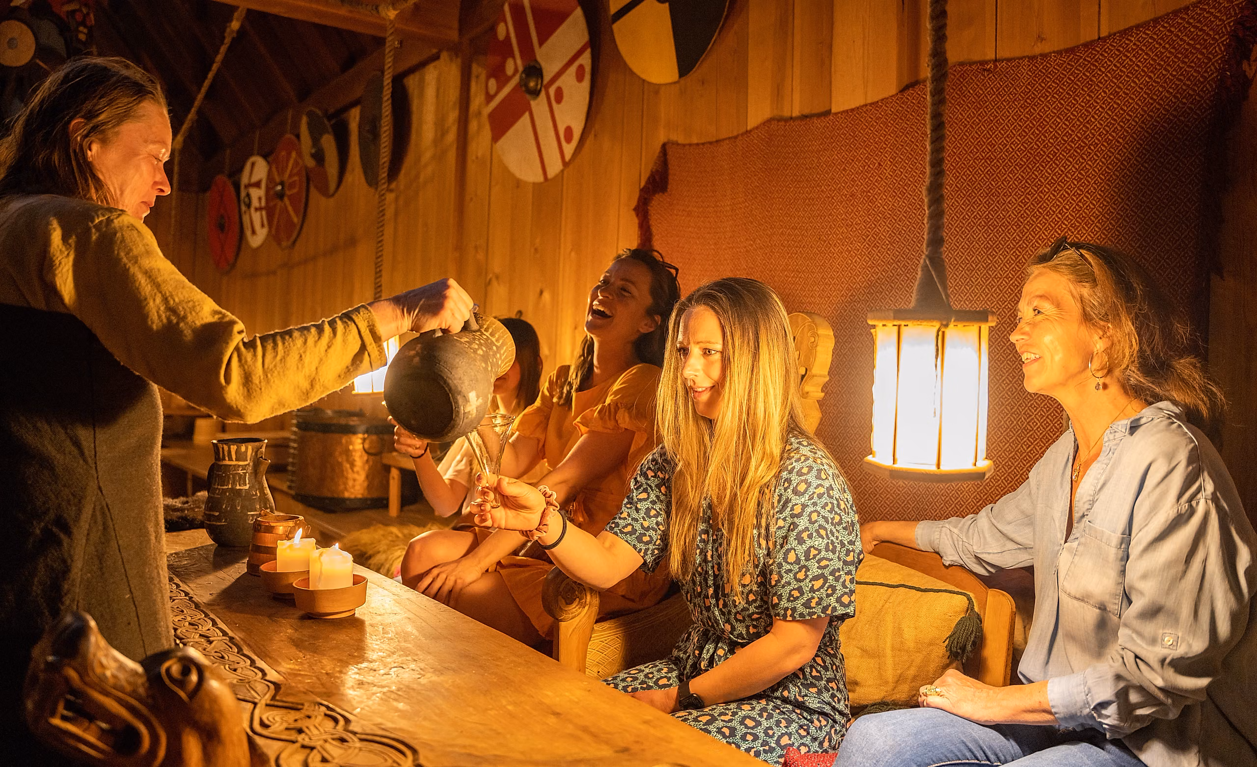 A group of people visiting the Midgard Viking center at Borre, in Vestfold
