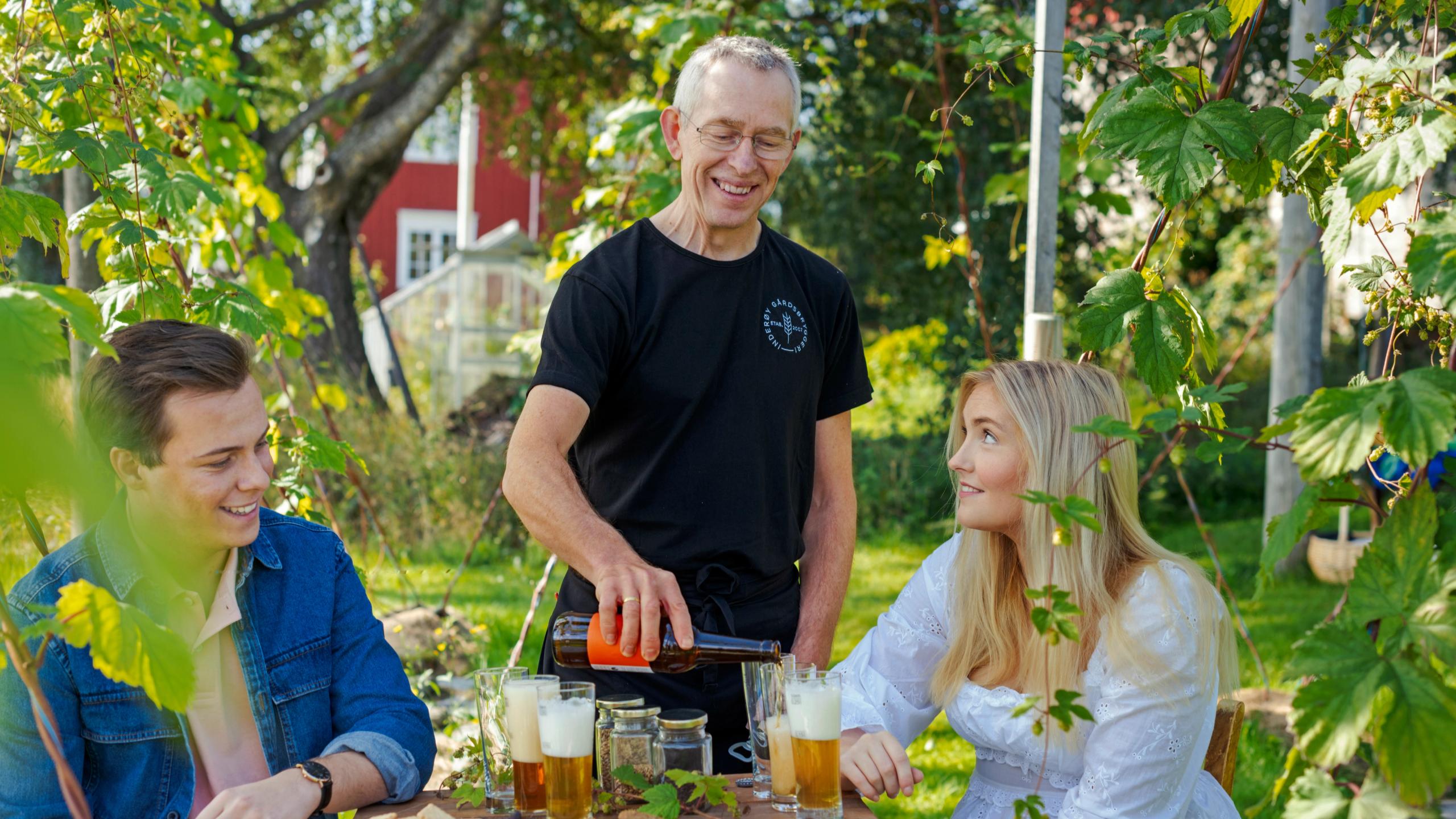 Two people being served local food on a summer day at Inderøy, Trøndelag