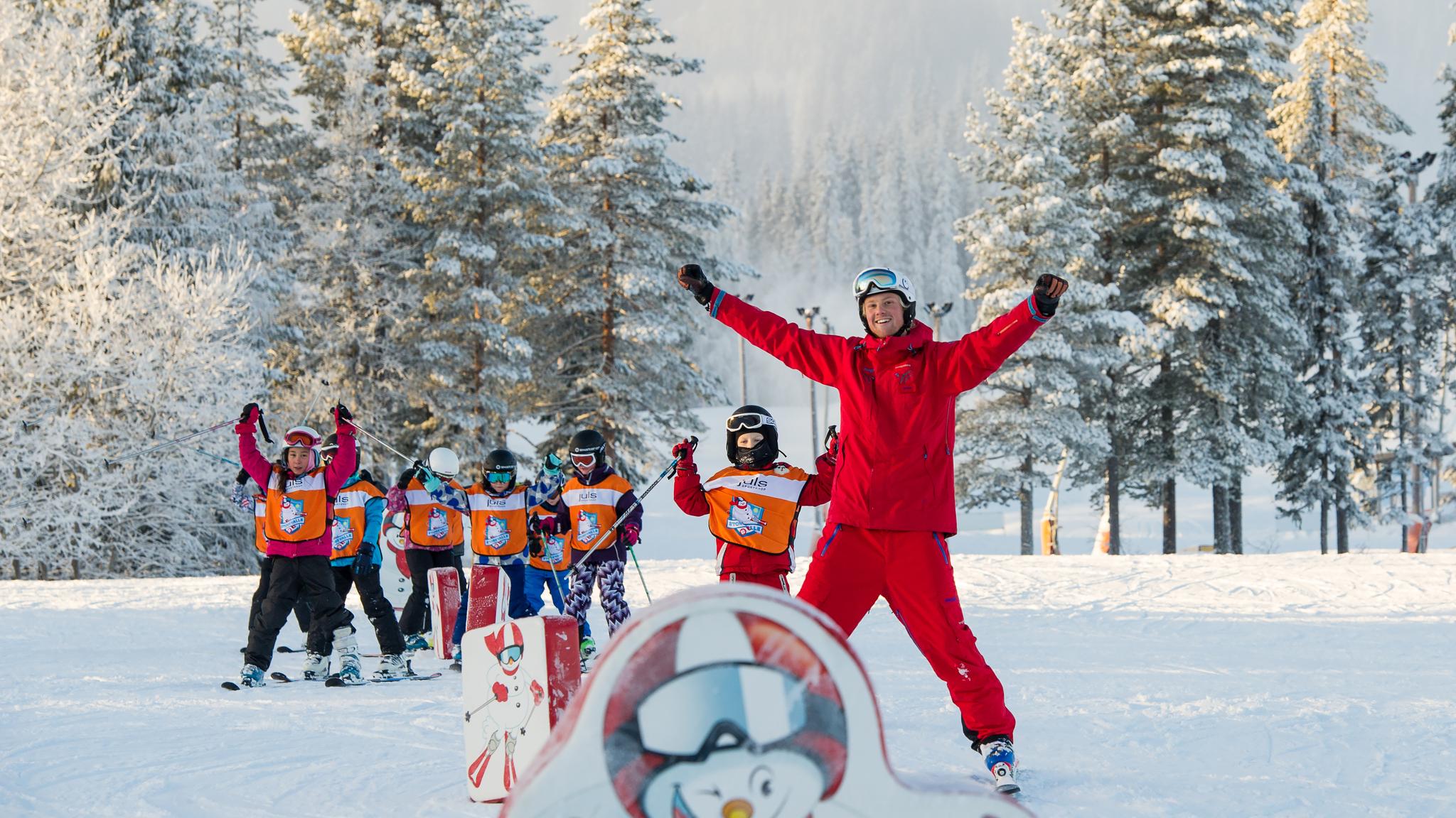Children skiing with an instructor in Trysil ski school, Eastern Norway