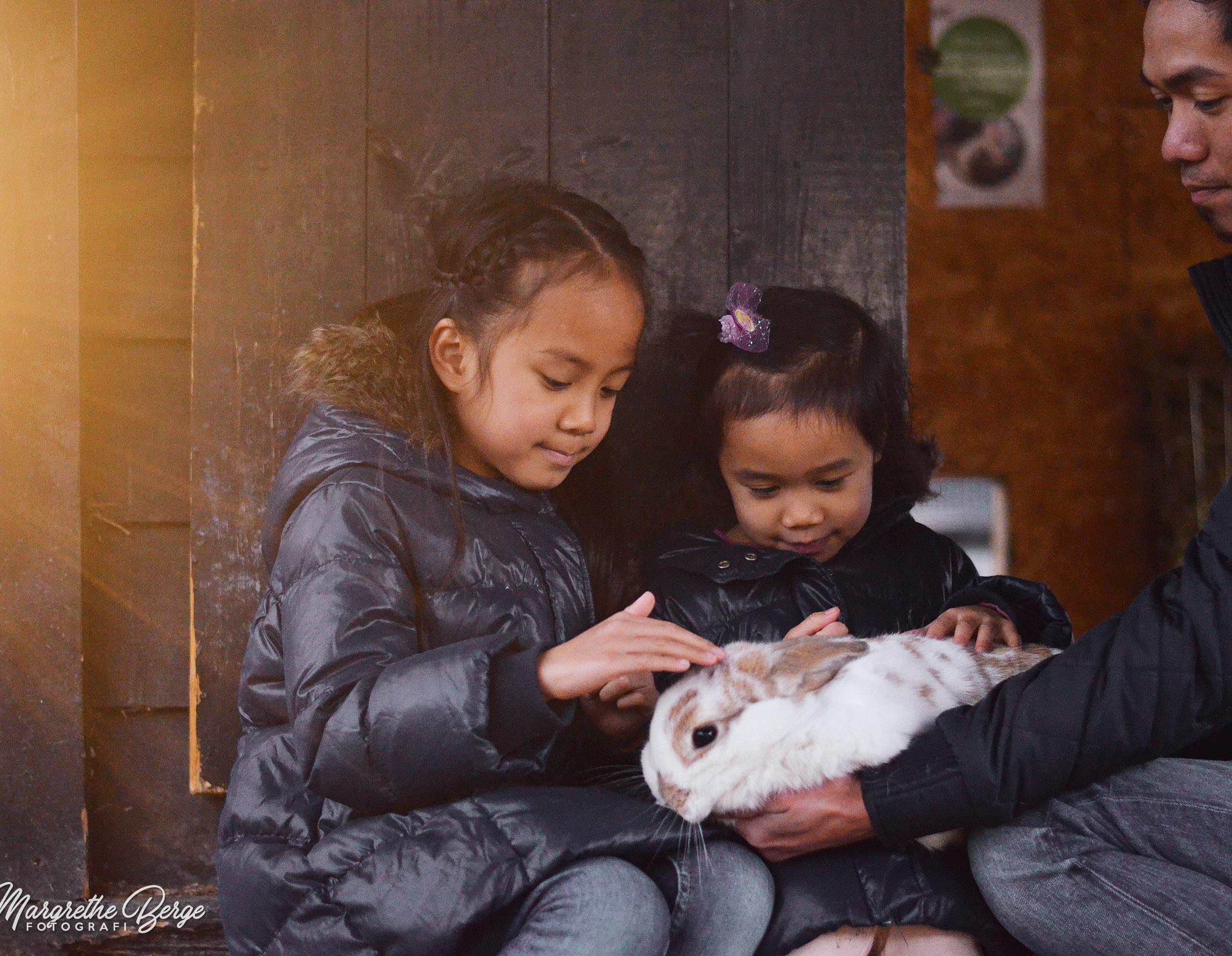 Girls petting rabbit at Ekeberg