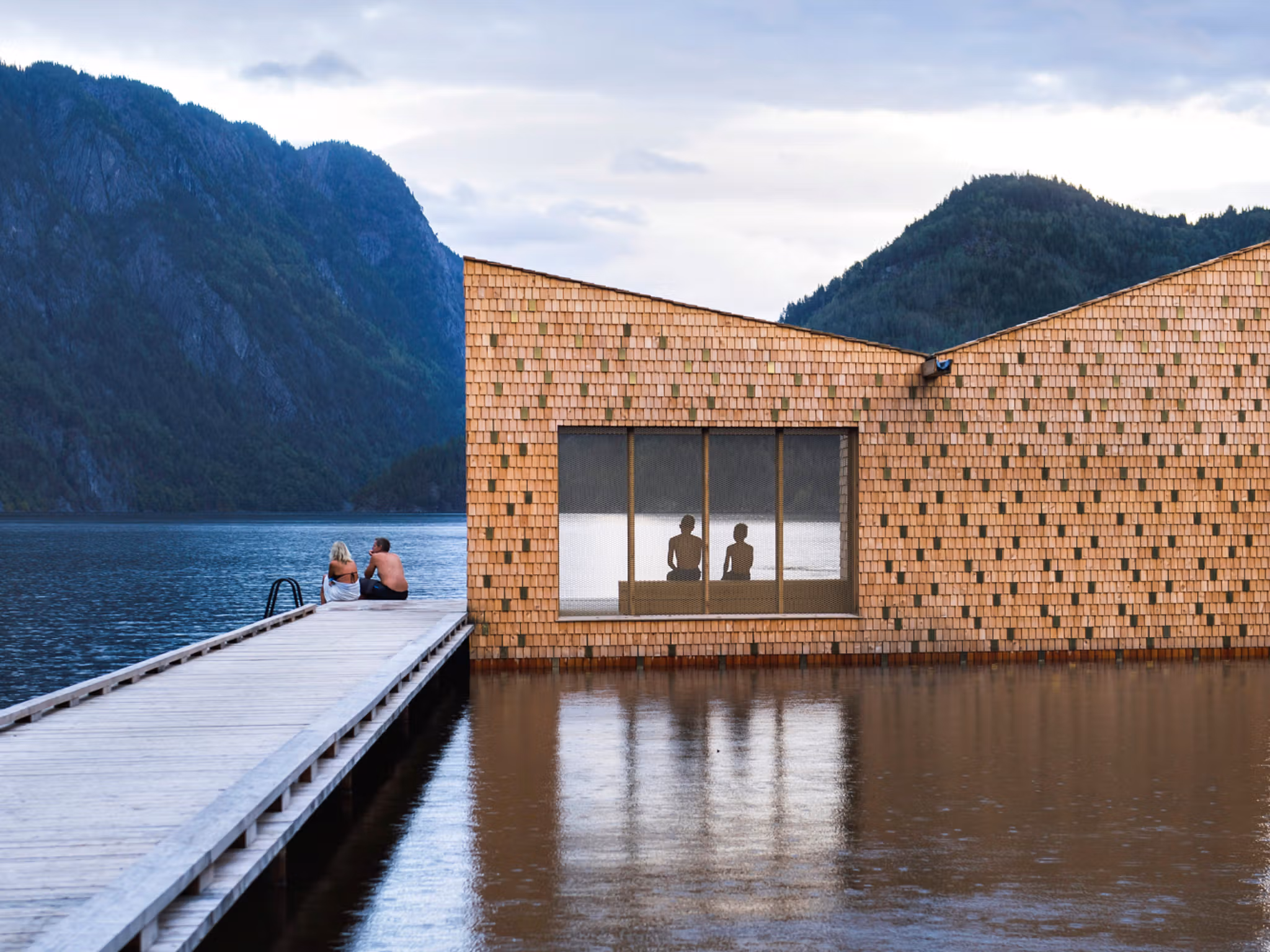 People enjoying the floating Soria Moria sauna in Telemark