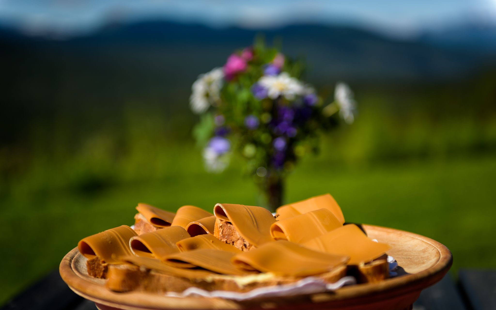 A plate with bread and brown cheese, locally produced in Lillehammer in Eastern Norway