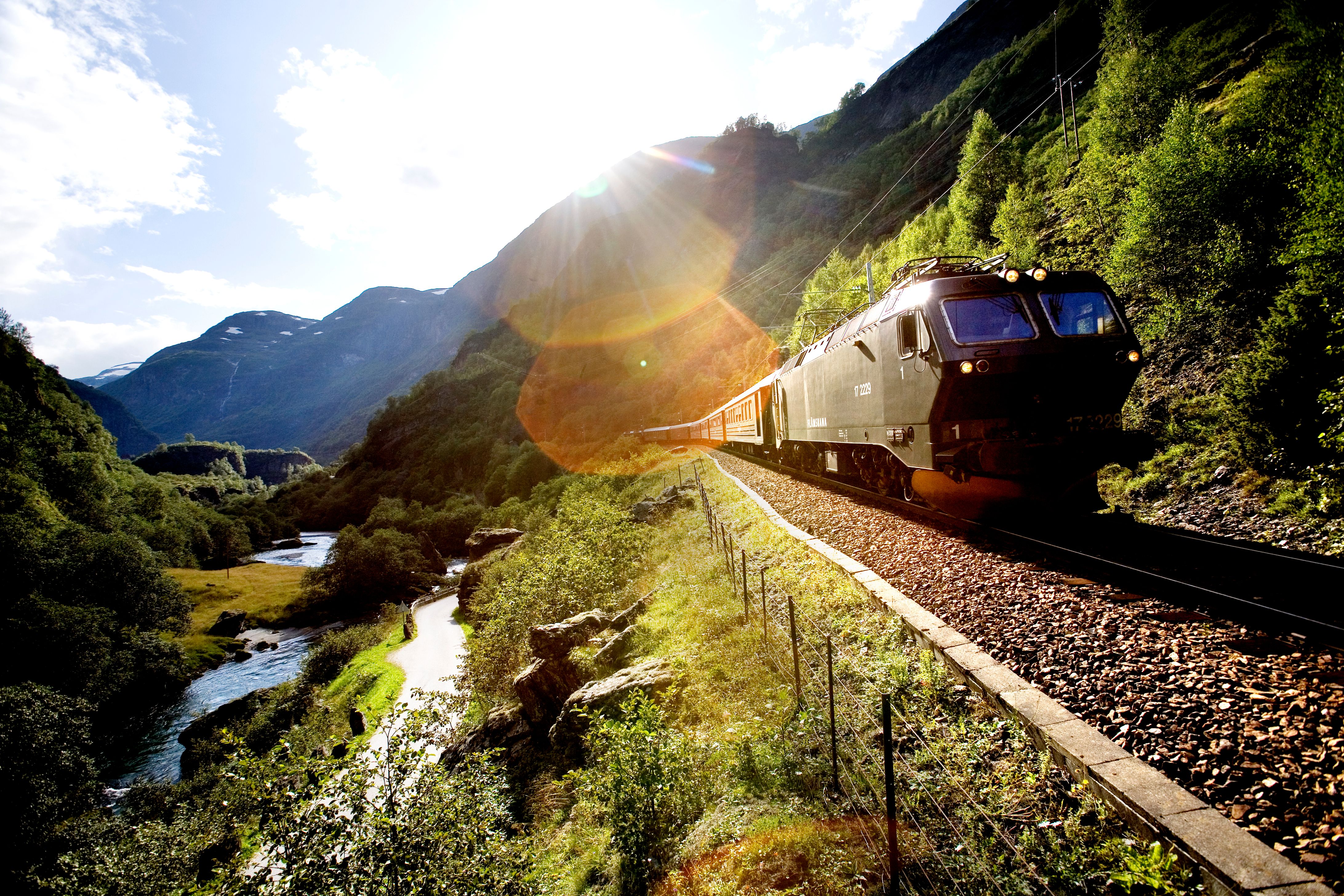 The train passes on the Flåm Railway, in Flåm