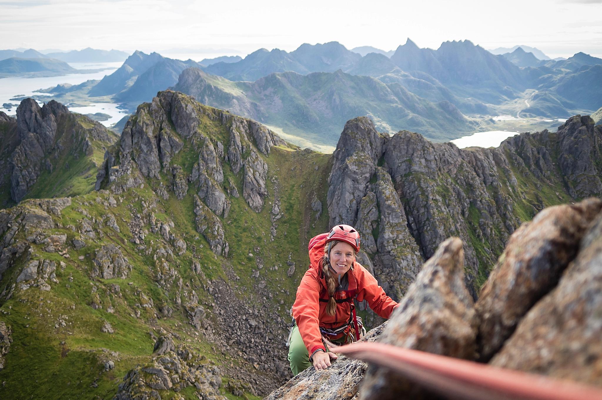 A woman climbing Reka mountain in Vesterålen in Northern Norway