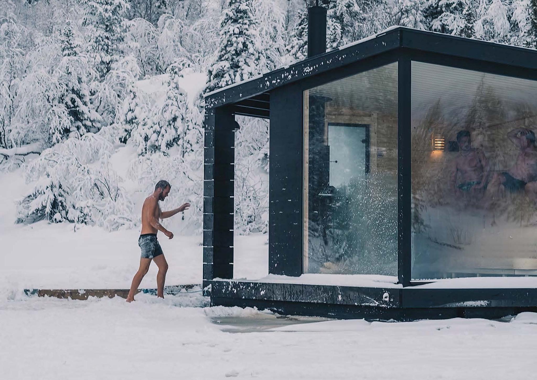A person walking into the floating sauna during winter in Rjukan in Telemark, Eastern Norway