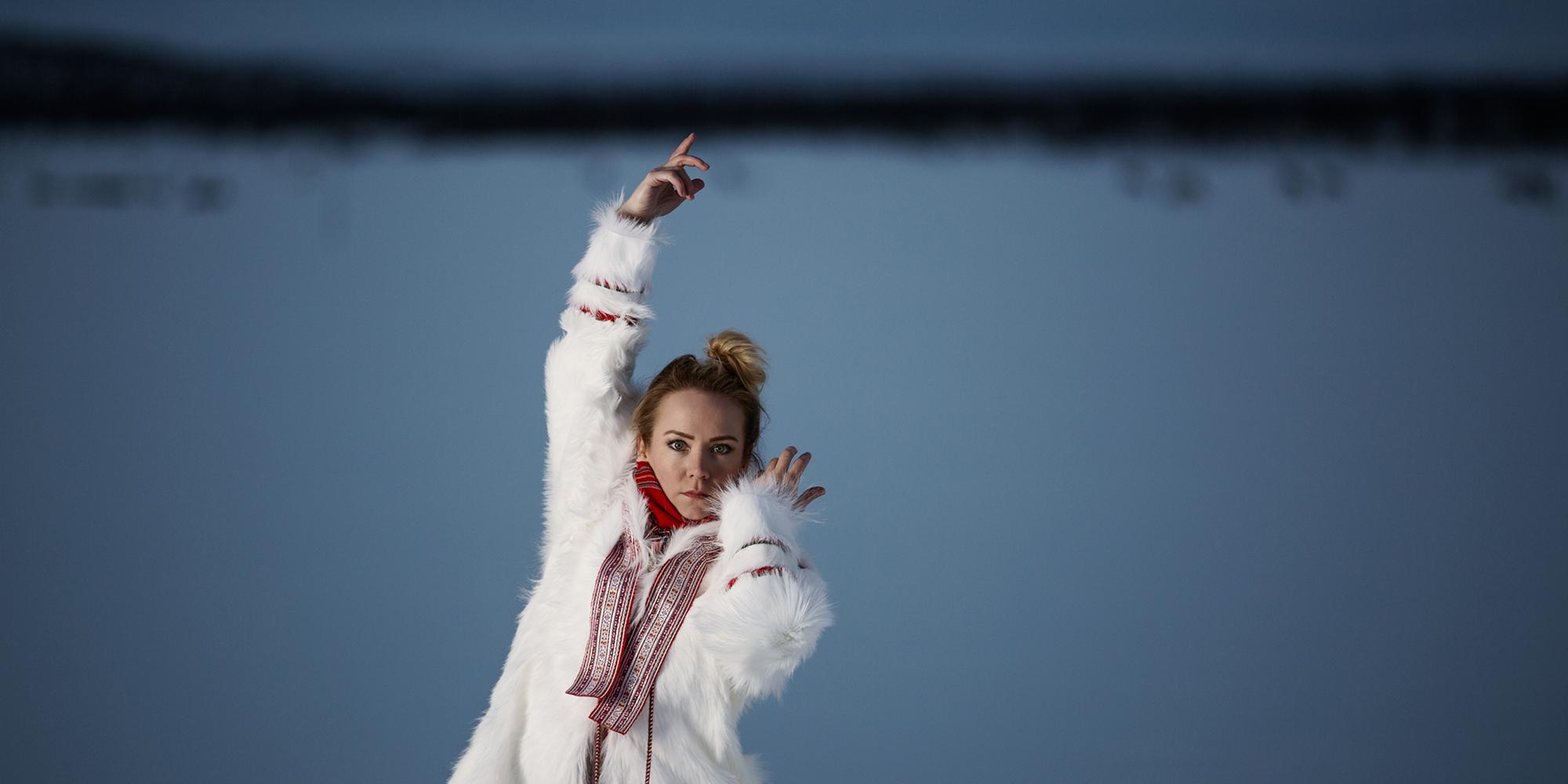 The rebirth of the joik: portrait photo of the Sami artist Elle Márjá Eira outside during winter in Northern Norway.