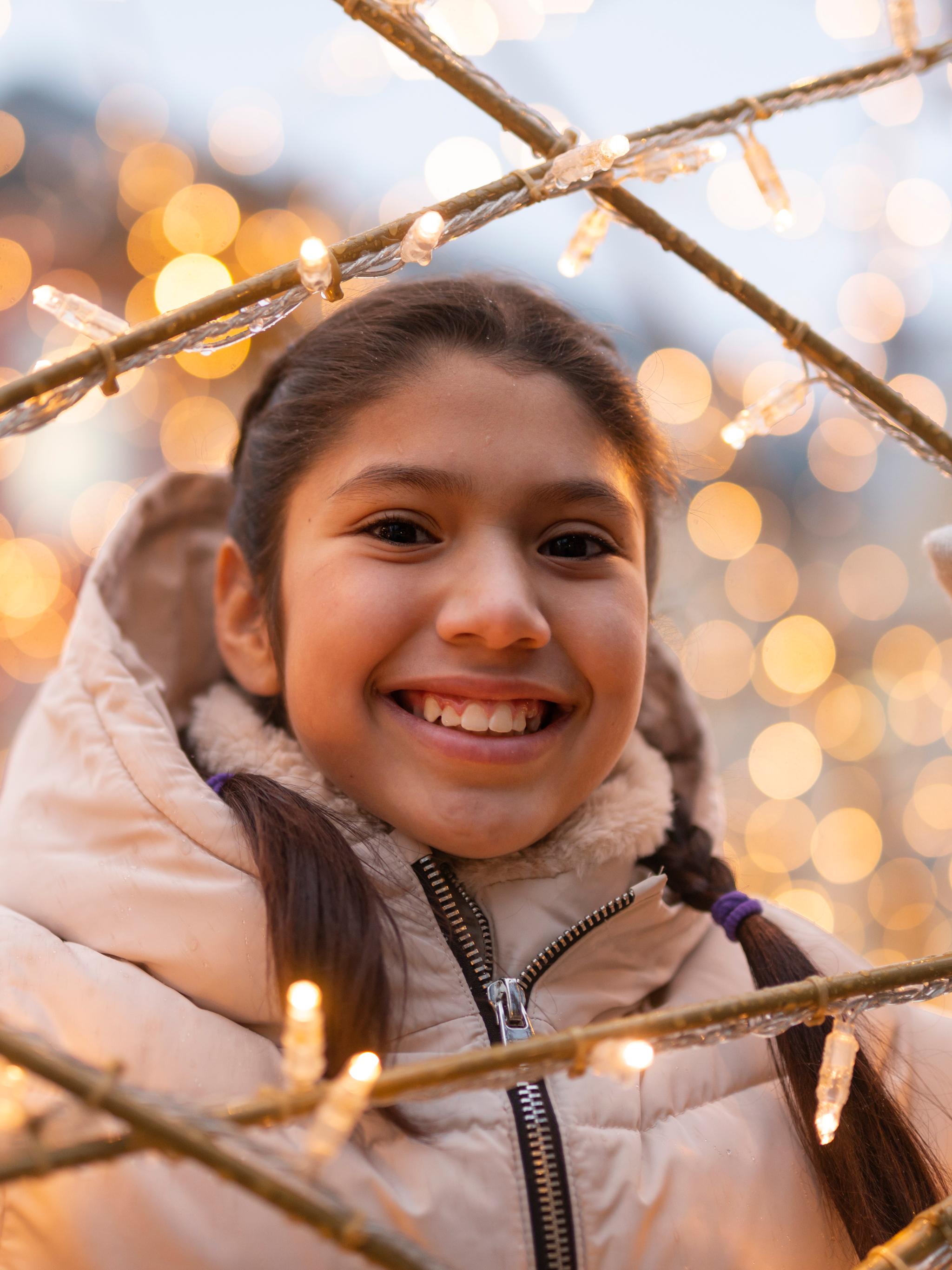 A girl smiling in Kristiansand Christmas town