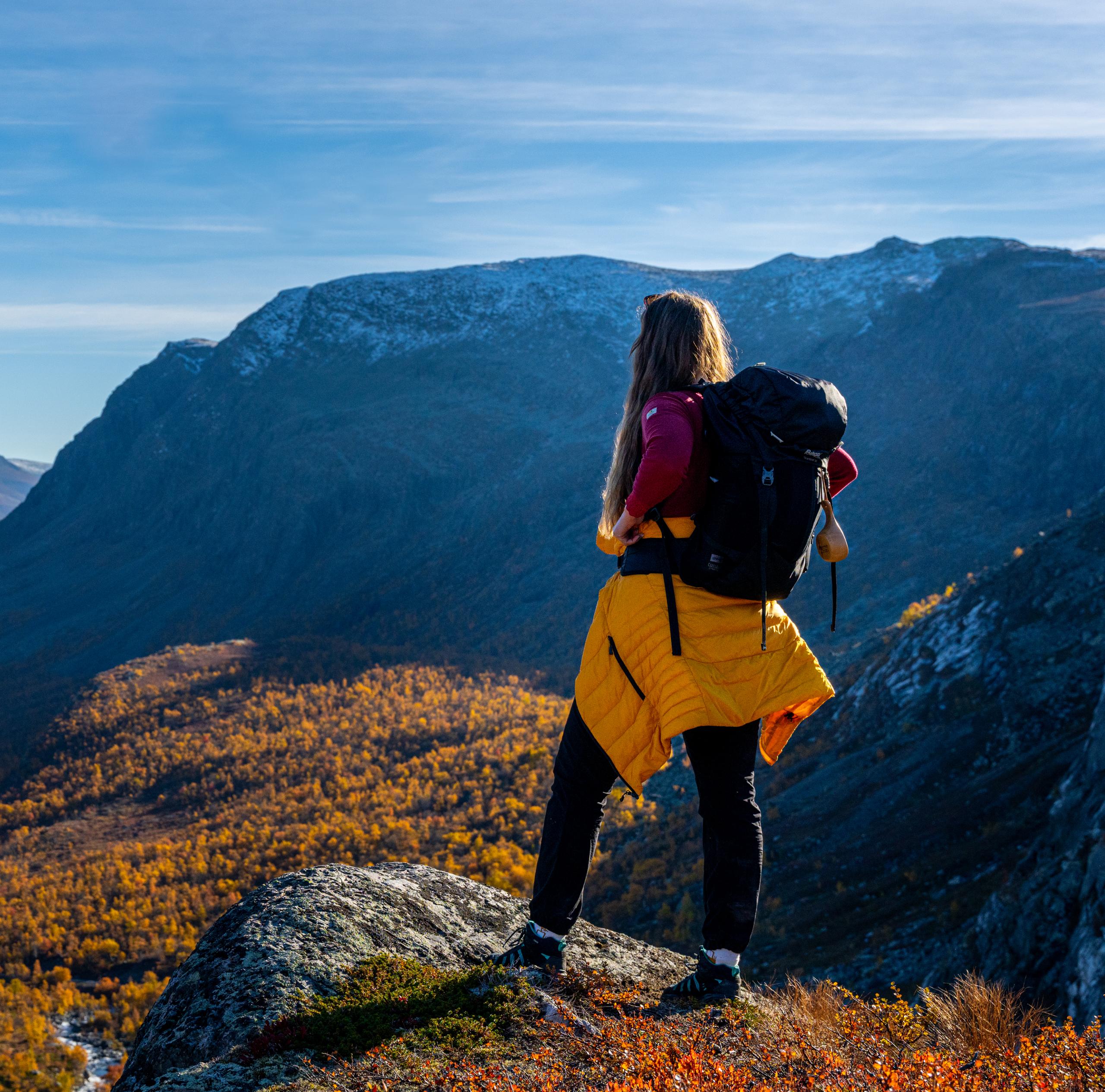 Woman enjoying the autumn view of Hydalen in Hemsedal