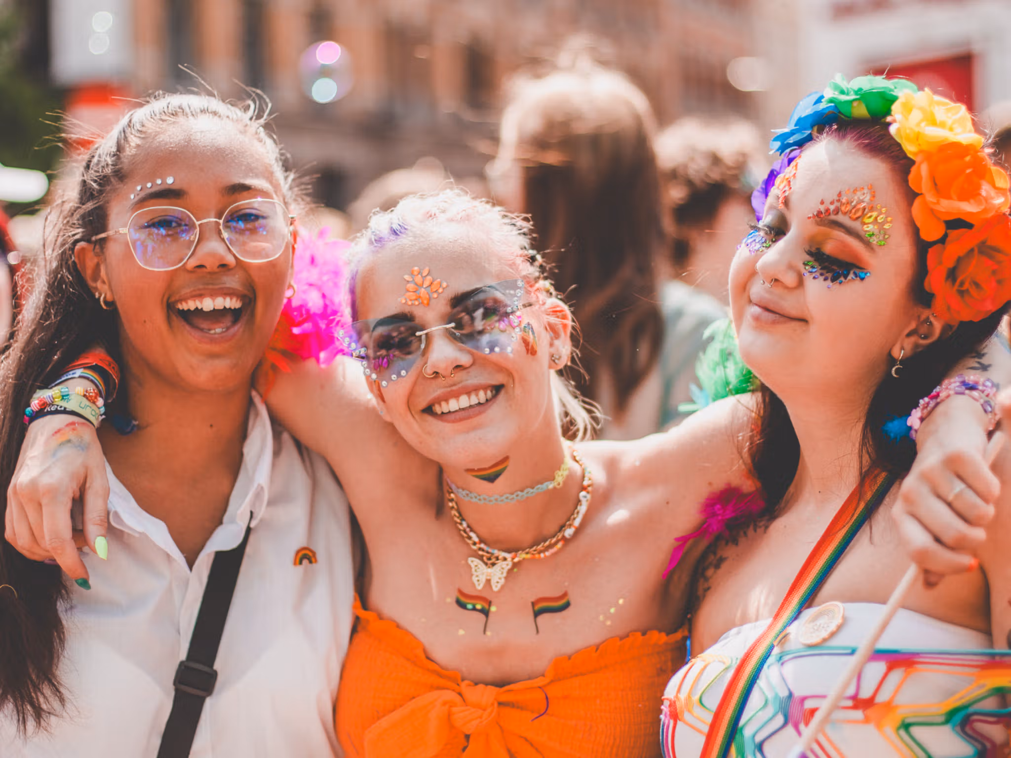 Three girls smiling in the Oslo Pride parade, 2023