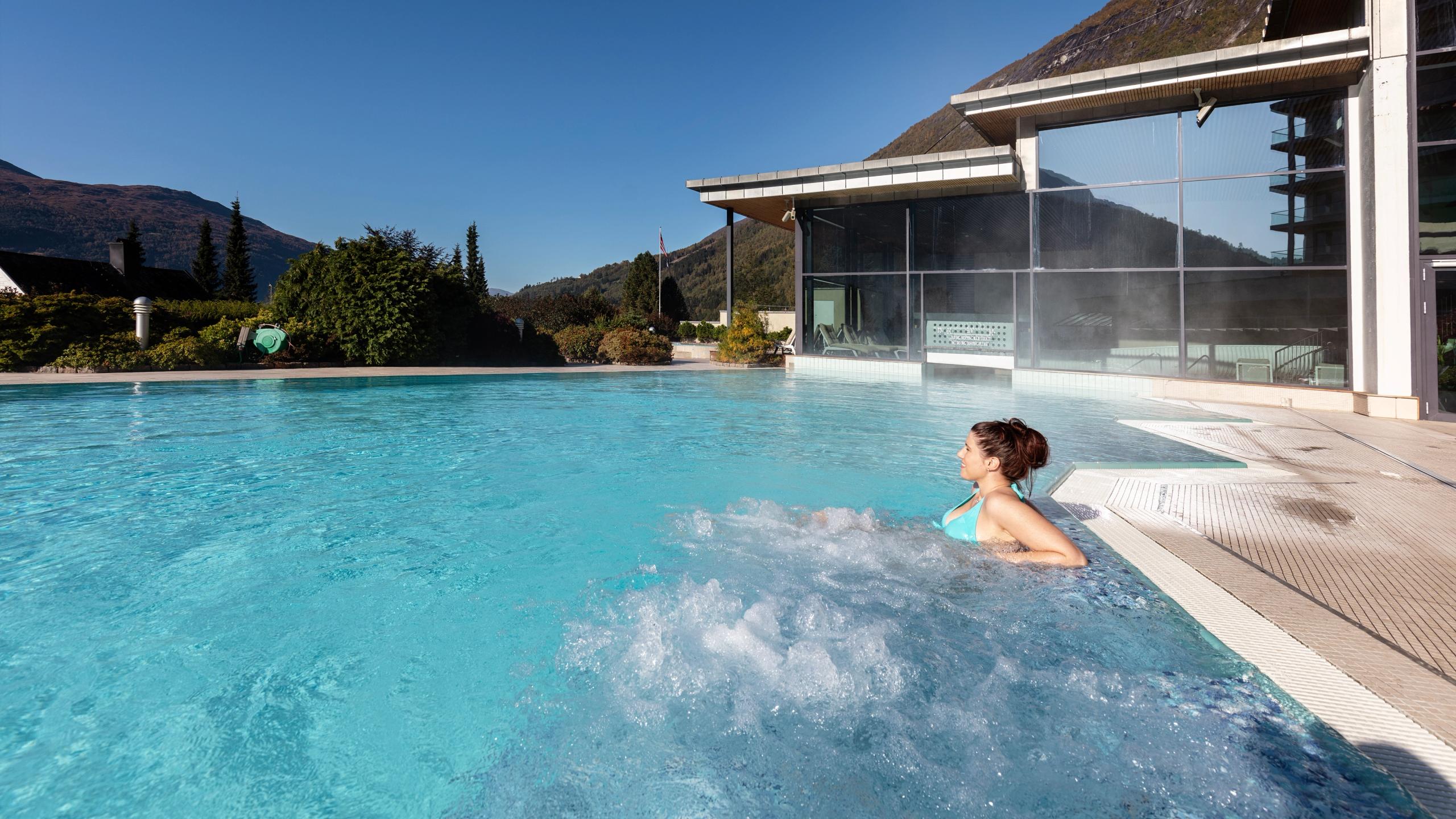 A woman is relaxing in the pool at Hotel Alexandra in Stryn in Nordfjord, Fjord Norway