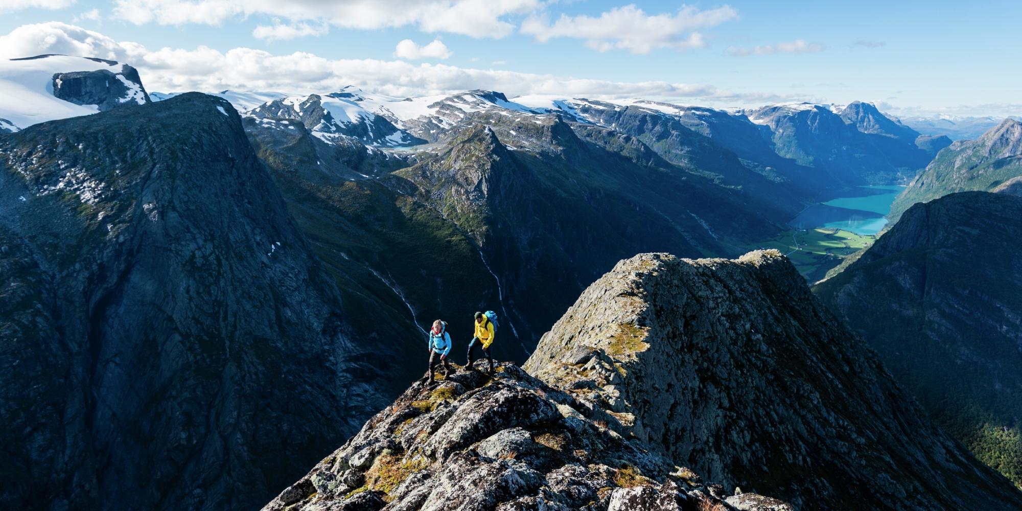 Two people hiking Mount Kattanakken in Jostedalsbreen national park, Fjord Norway