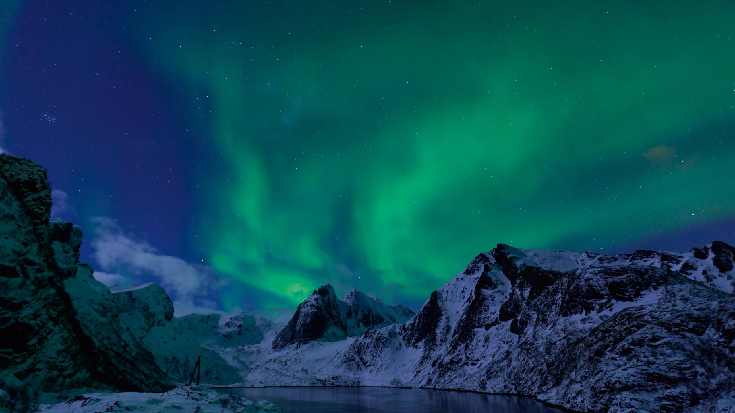 Northern lights over mountains in the Lofoten Islands in Northern Norway