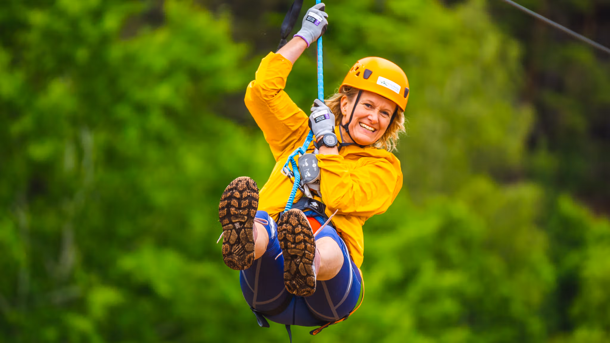 Woman in a zip line at Via Ferrata Haldenkanalen