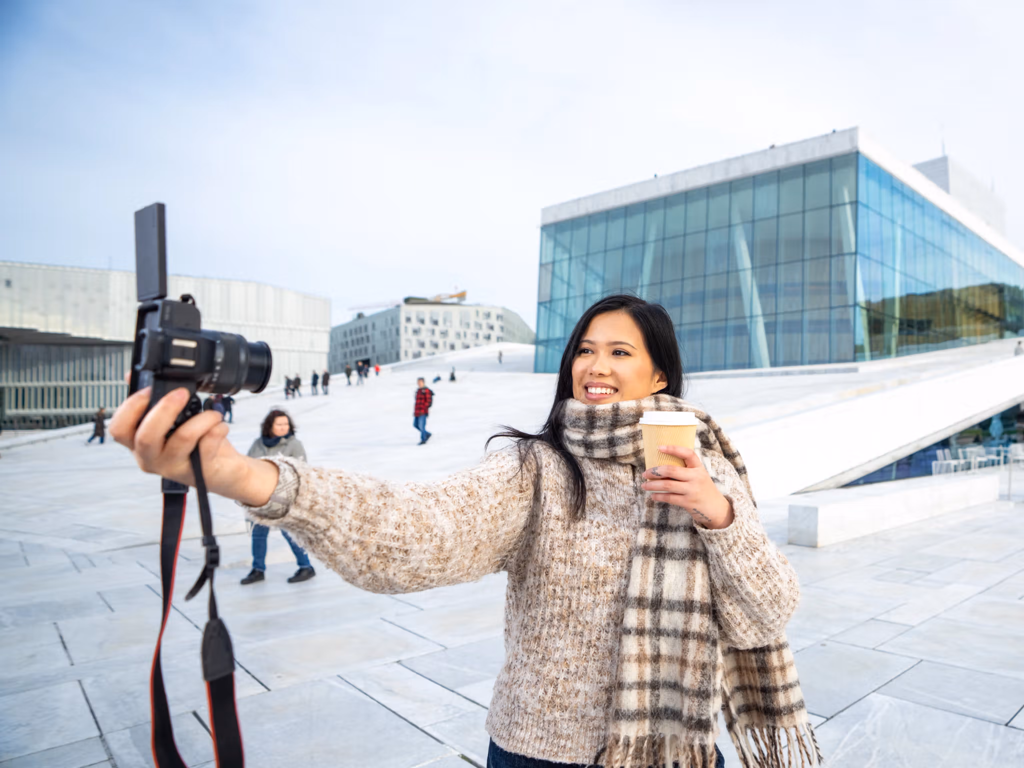 Woman by an opera house