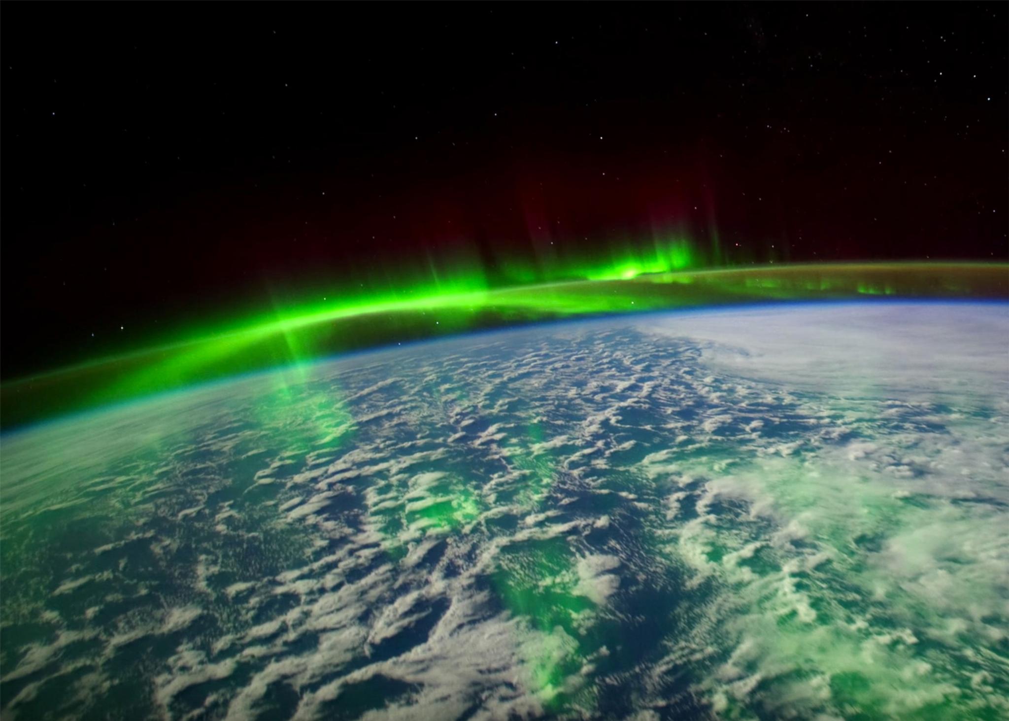 The earth with aurora borealis from space