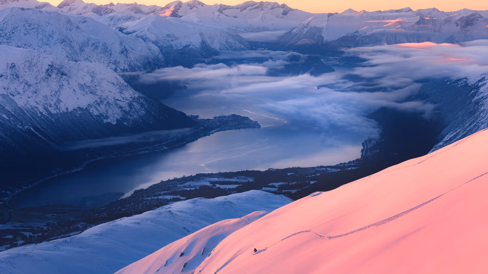 Person skiing at Kirketaket mountain in Åndalsnes, Fjord Norway