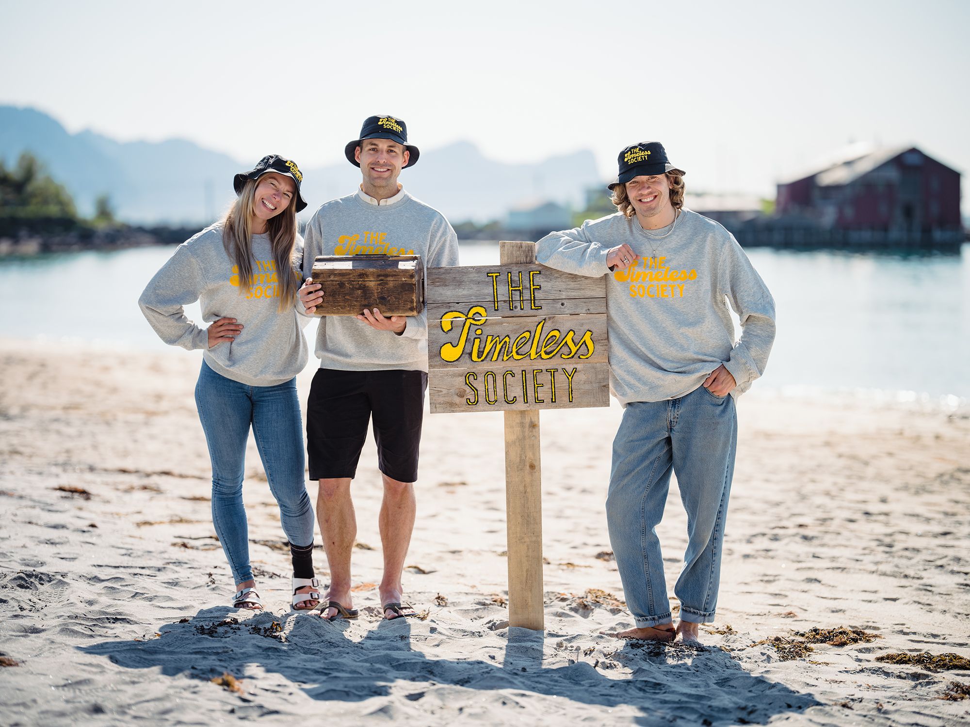 Visitors by sign that says Timeless Society in Senja