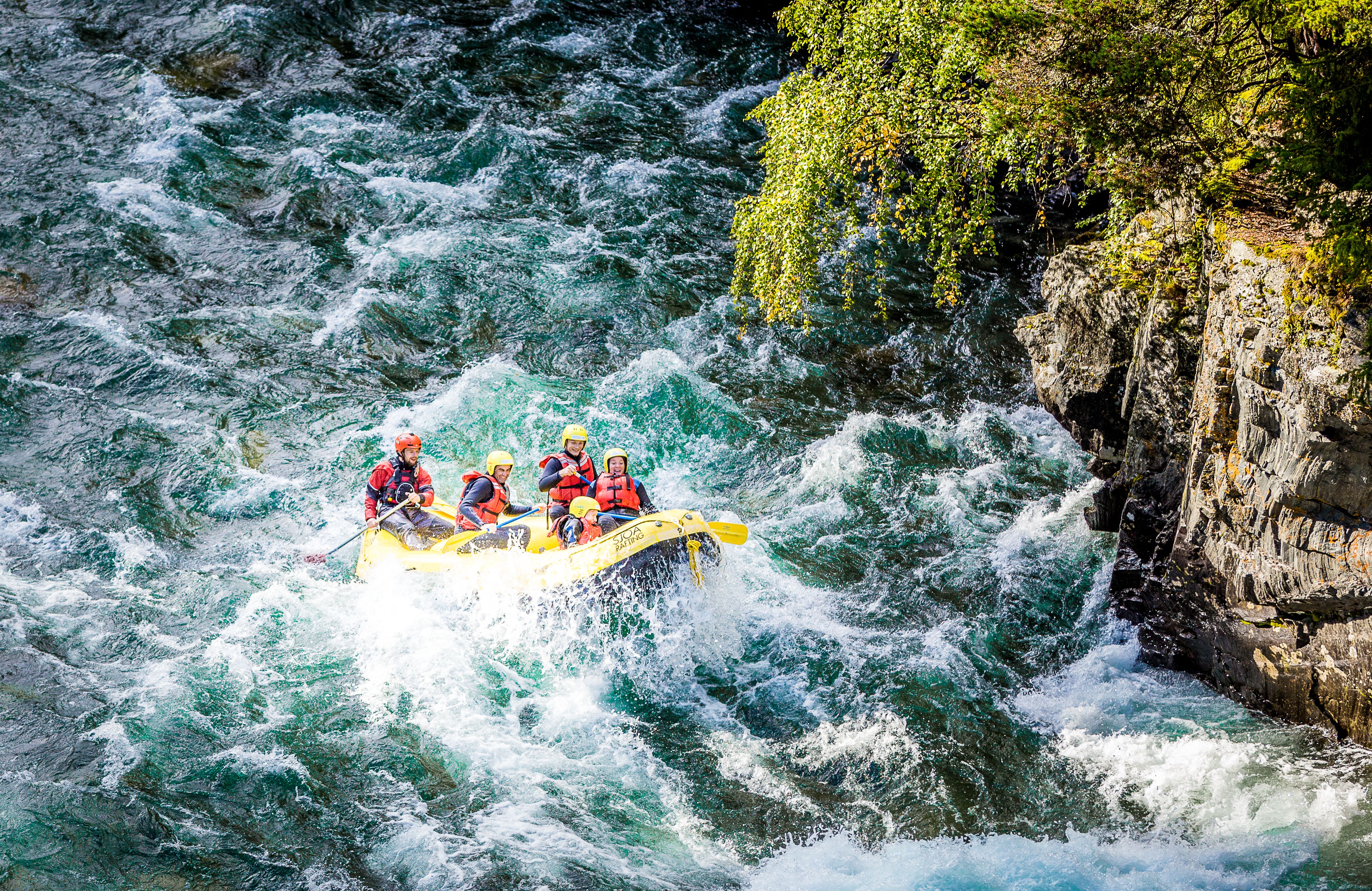 A group of people white water rafting in Sjoa river in the Jotunheimen mountains in Eastern Norway