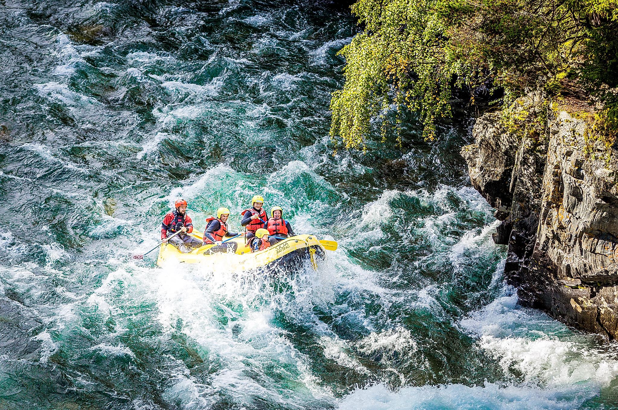 A group of people white water rafting in Sjoa river in the Jotunheimen mountains in Eastern Norway