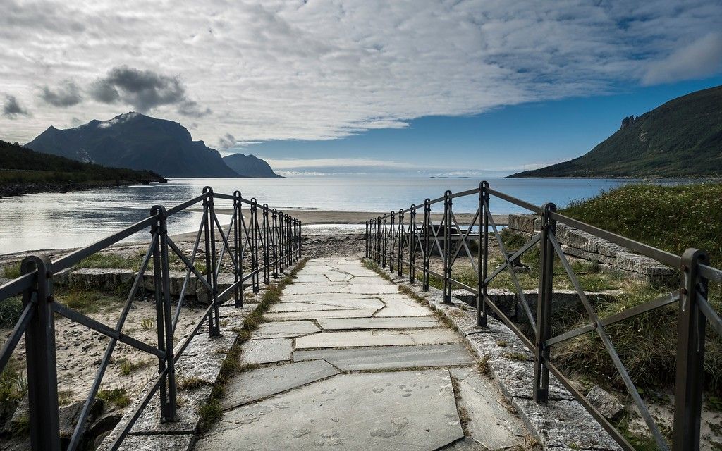 A bridge that leads to a beach.