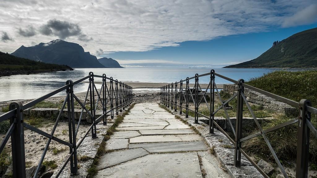 A bridge that leads to a beach.