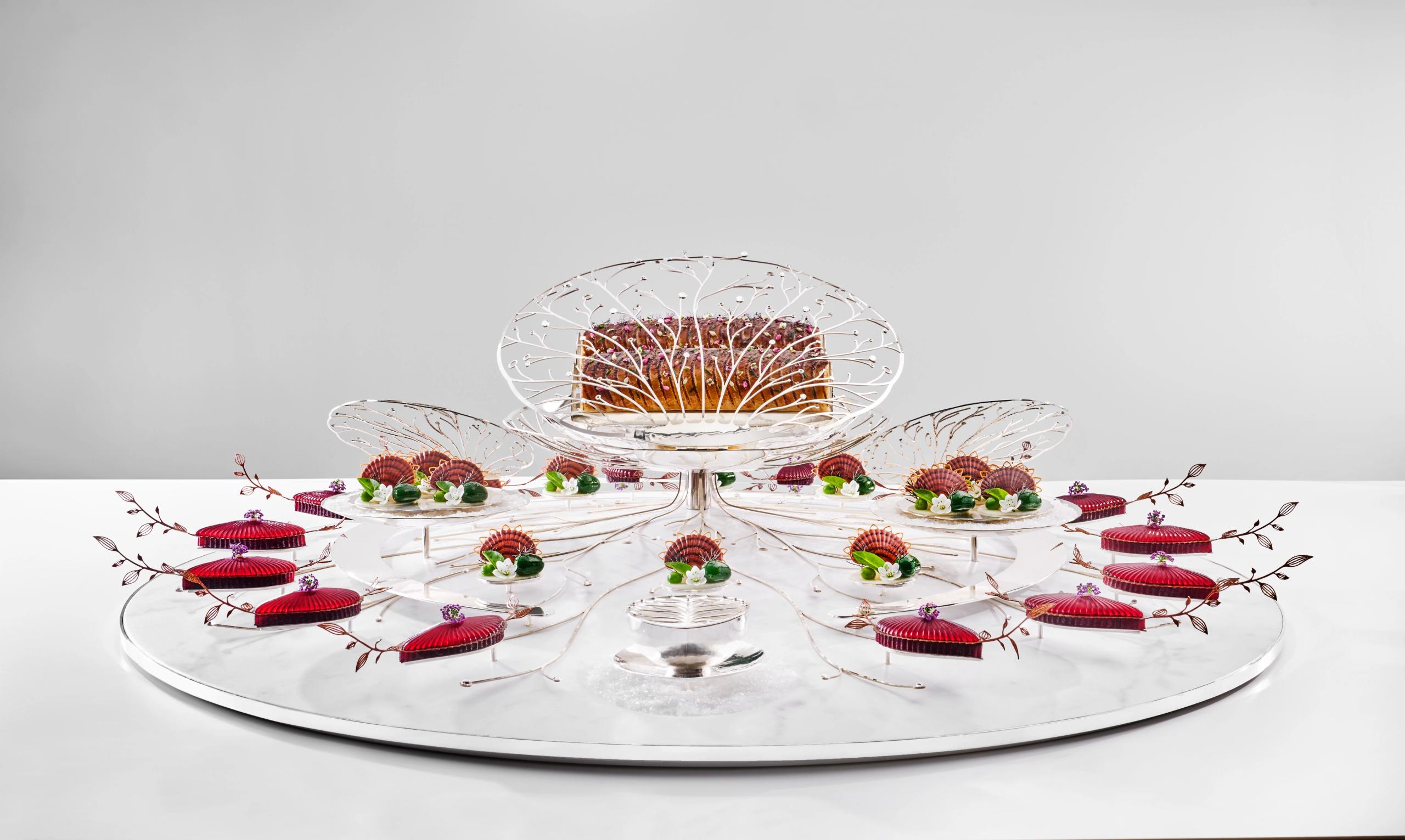 Skrei, beetroot, jerusalem artichoke and more beautifully arranged on a glass plate