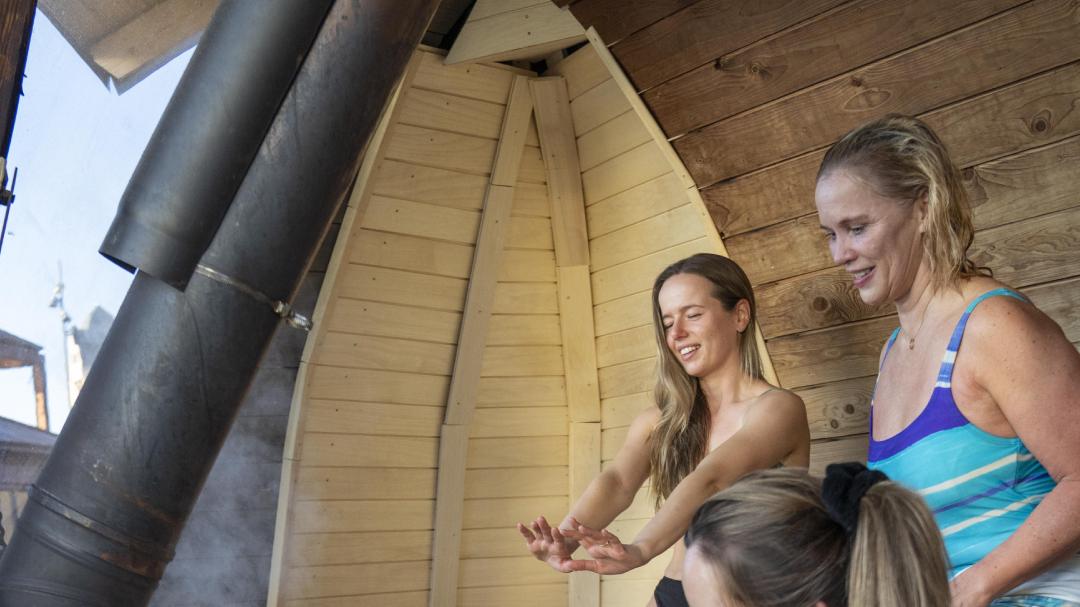 Friends sitting in sauna in Oslo, Eastern Norway