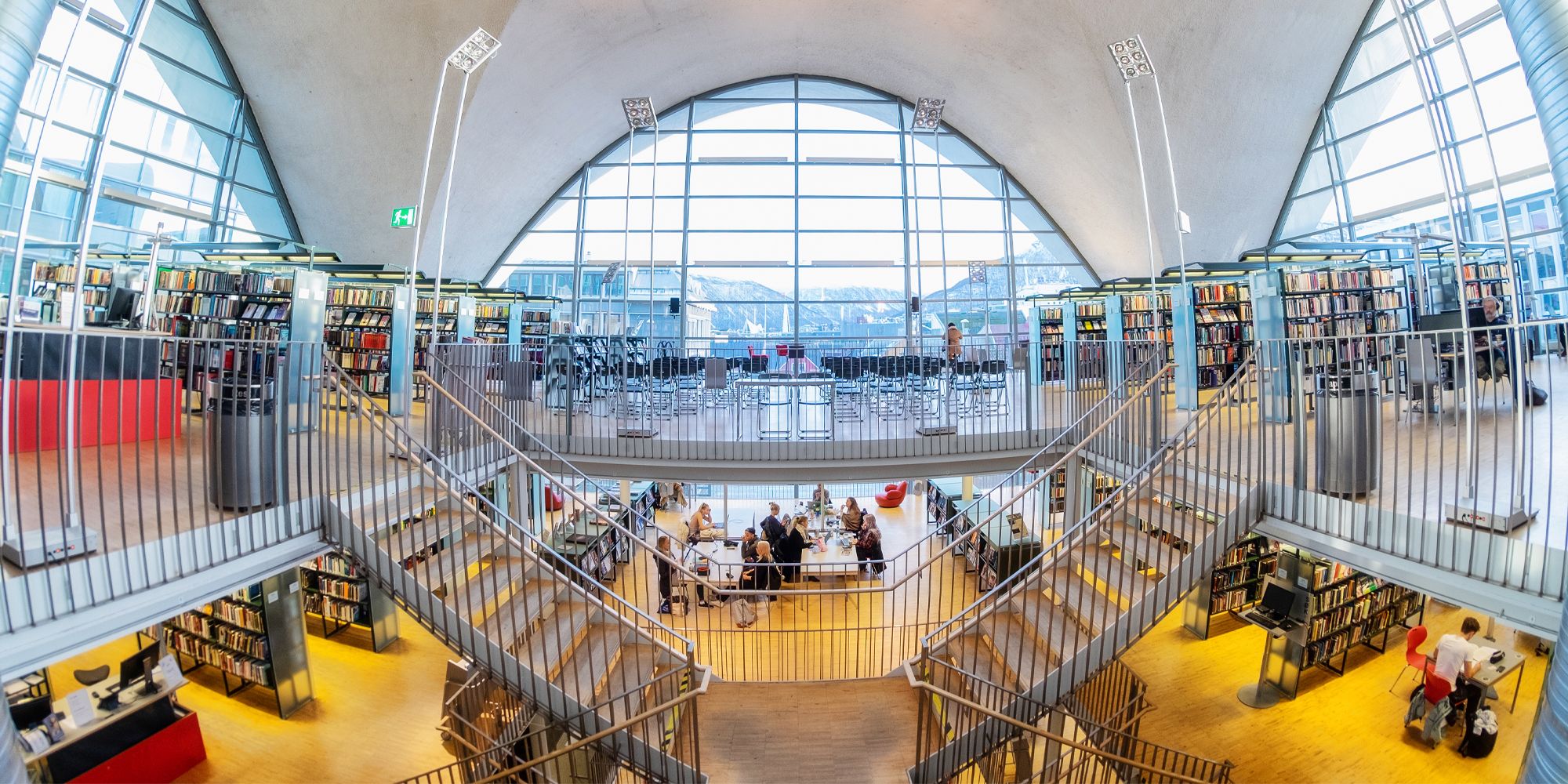 People reading Norwegian literature in Tromsø Library and City Archives