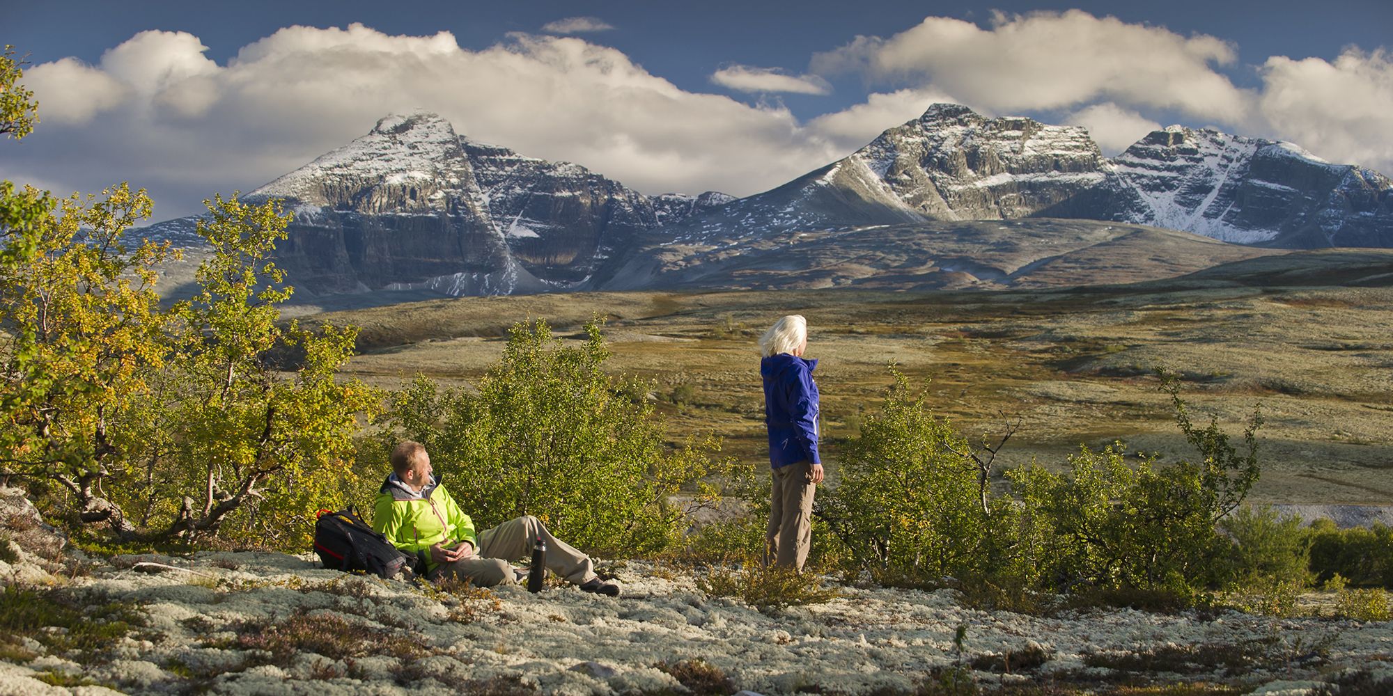 Two people taking a break on a hike in the Rondane montains, Eastern Norway