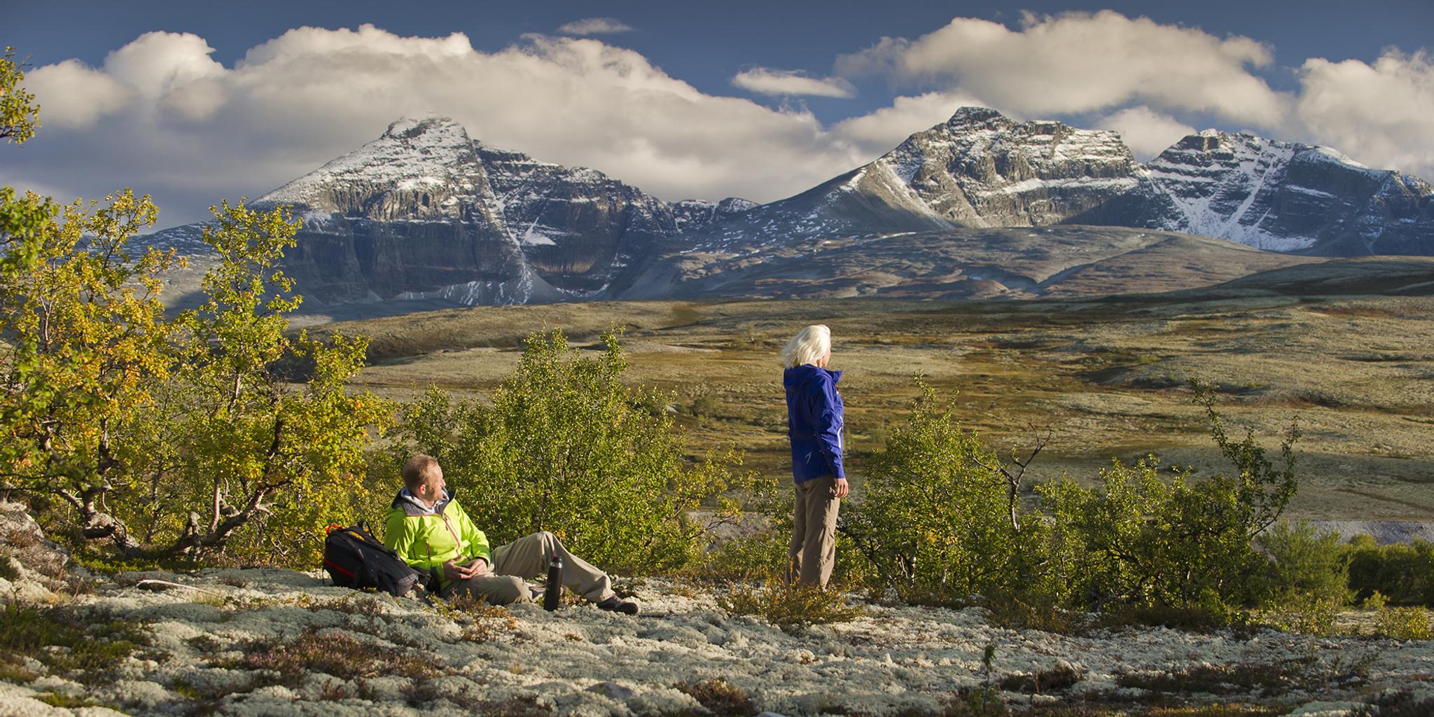 Two people taking a break on a hike in the Rondane montains, Eastern Norway
