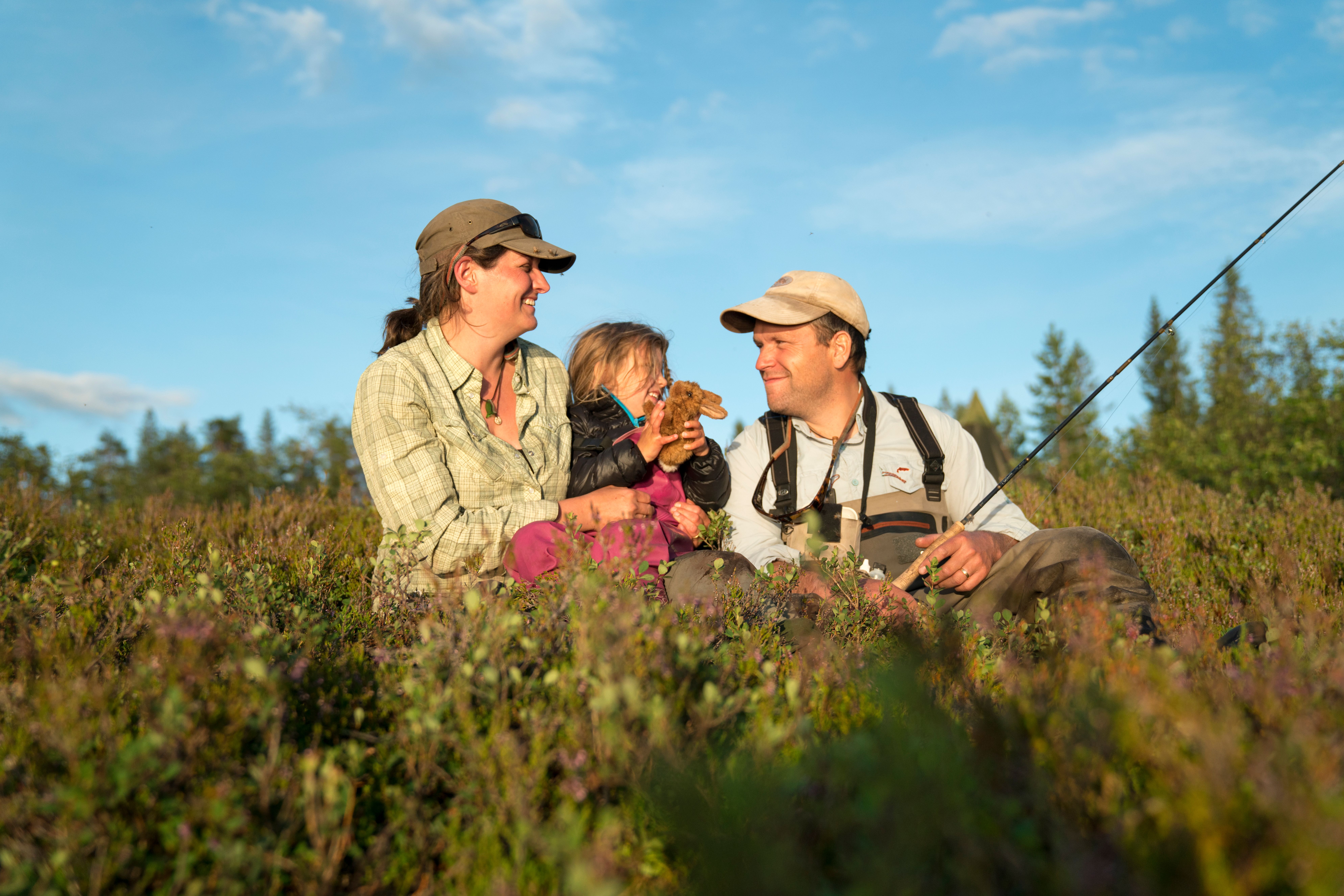 A family of three is fishing in the Blefjell mountain area in Eastern Norway
