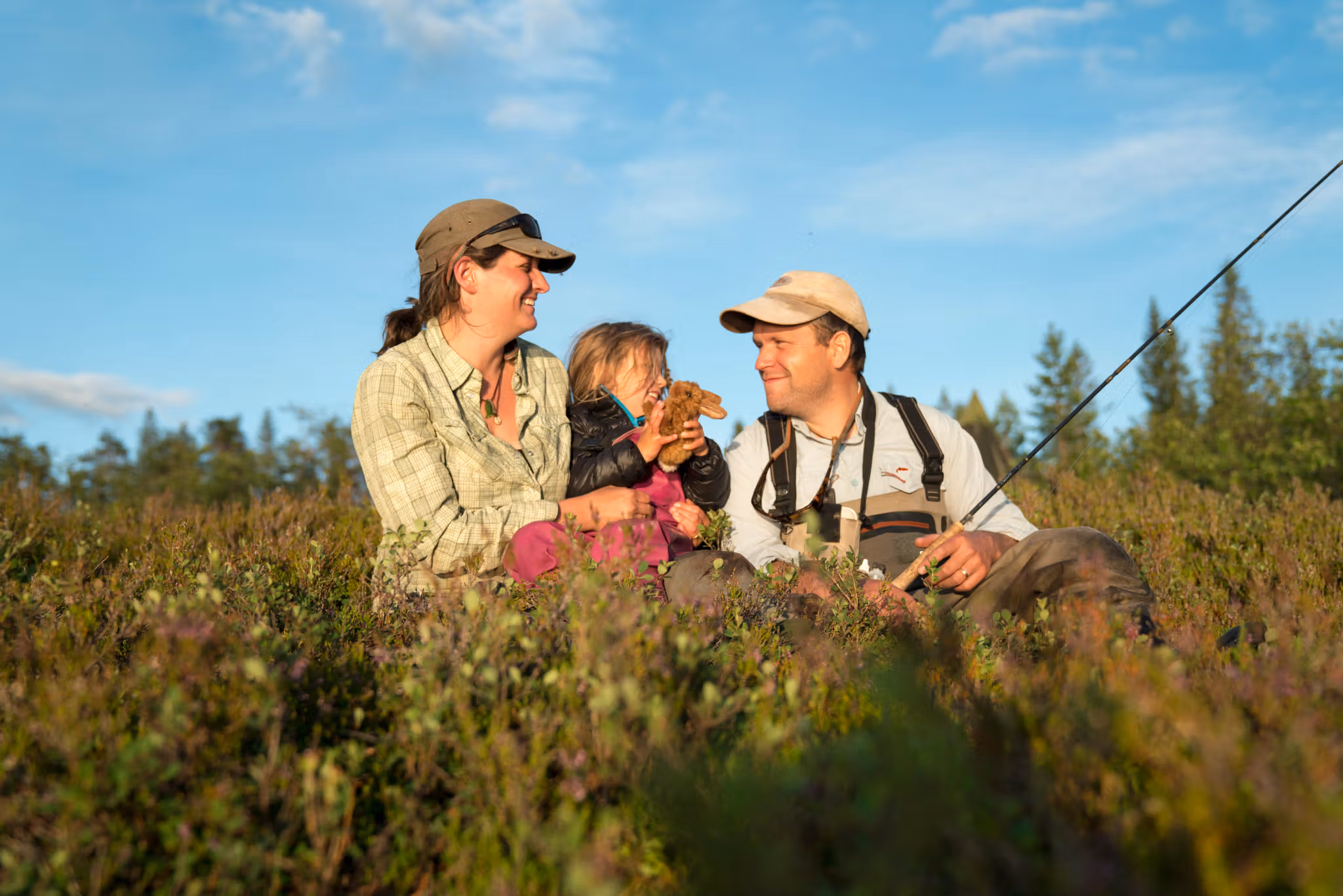 A family of three is fishing in the Blefjell mountain area in Eastern Norway