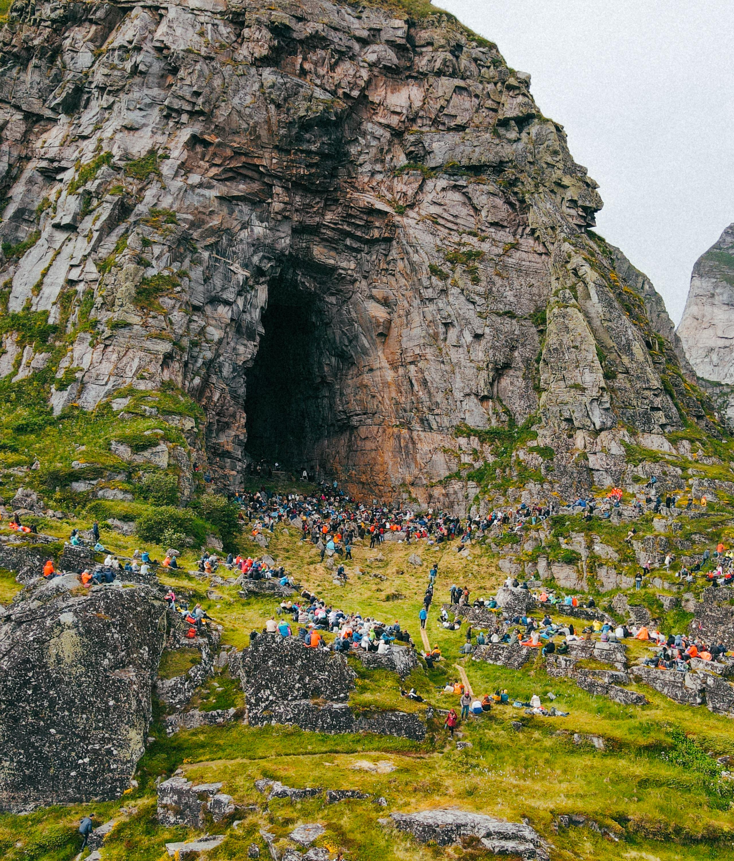 People at a concert in the Kirkhelleren cave in Træna, Helgeland, Northern Norway