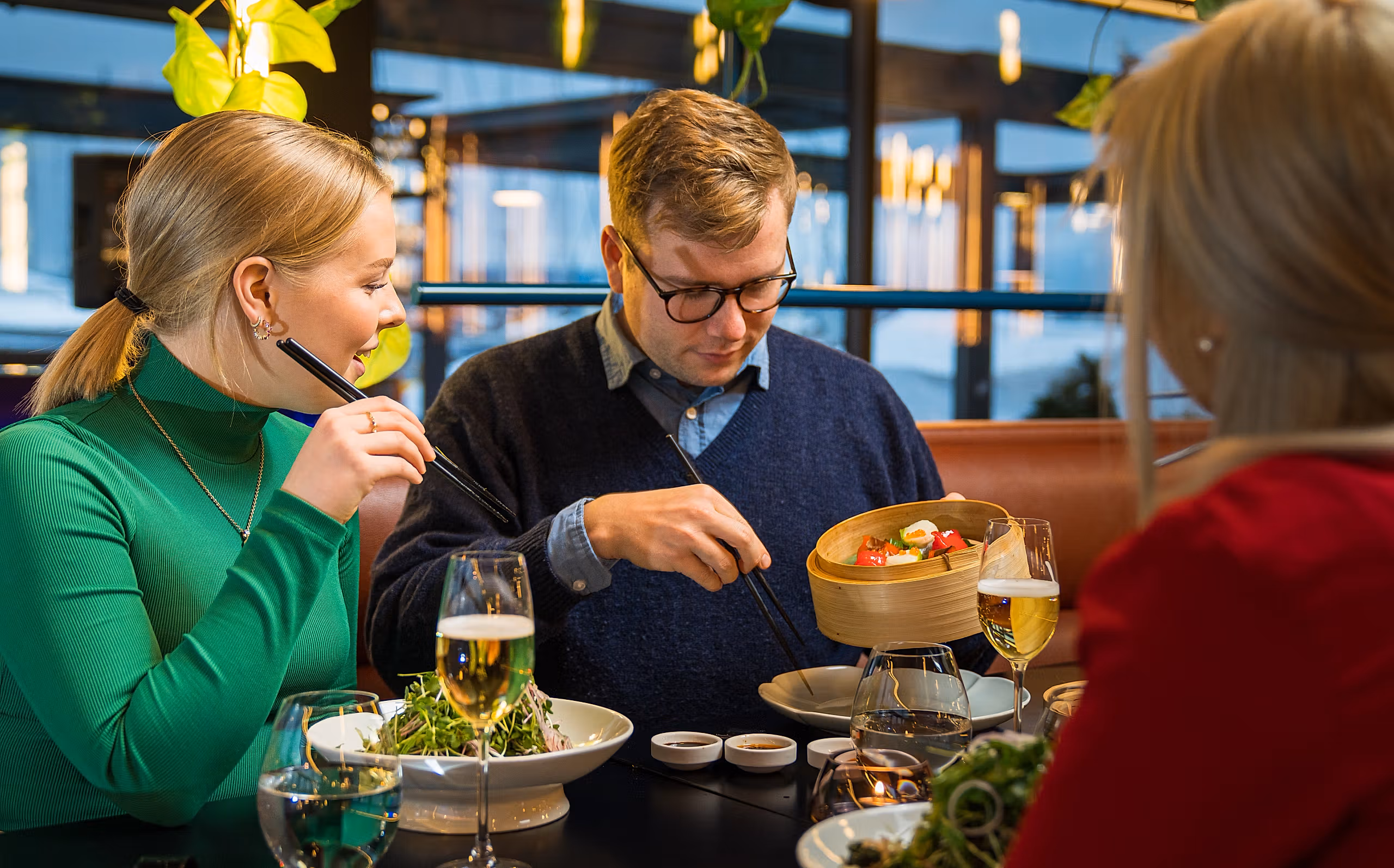 Friends enjoying dinner at a restaurant in Oslo