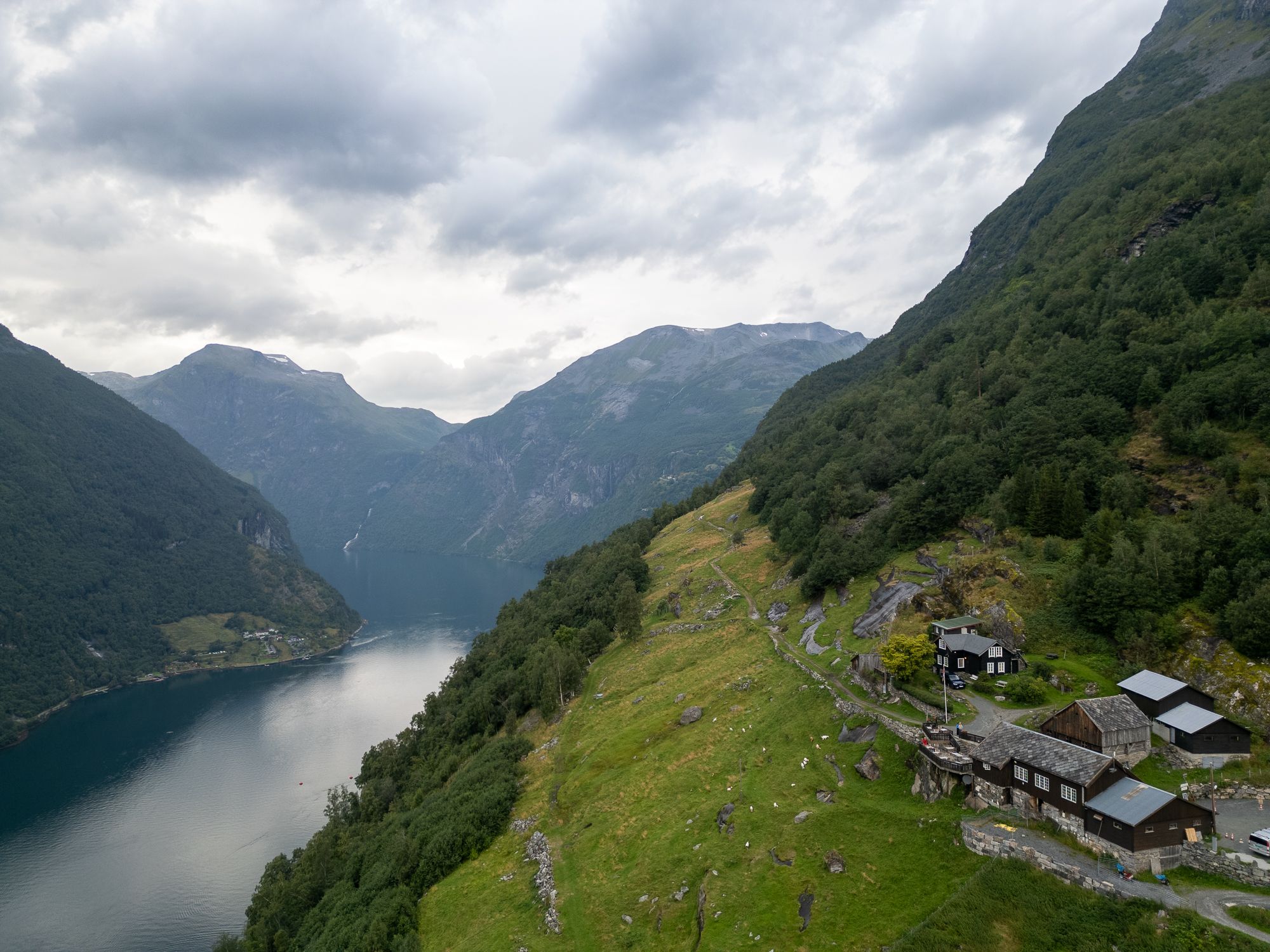 Birdseye view of a farm on a mountainside.