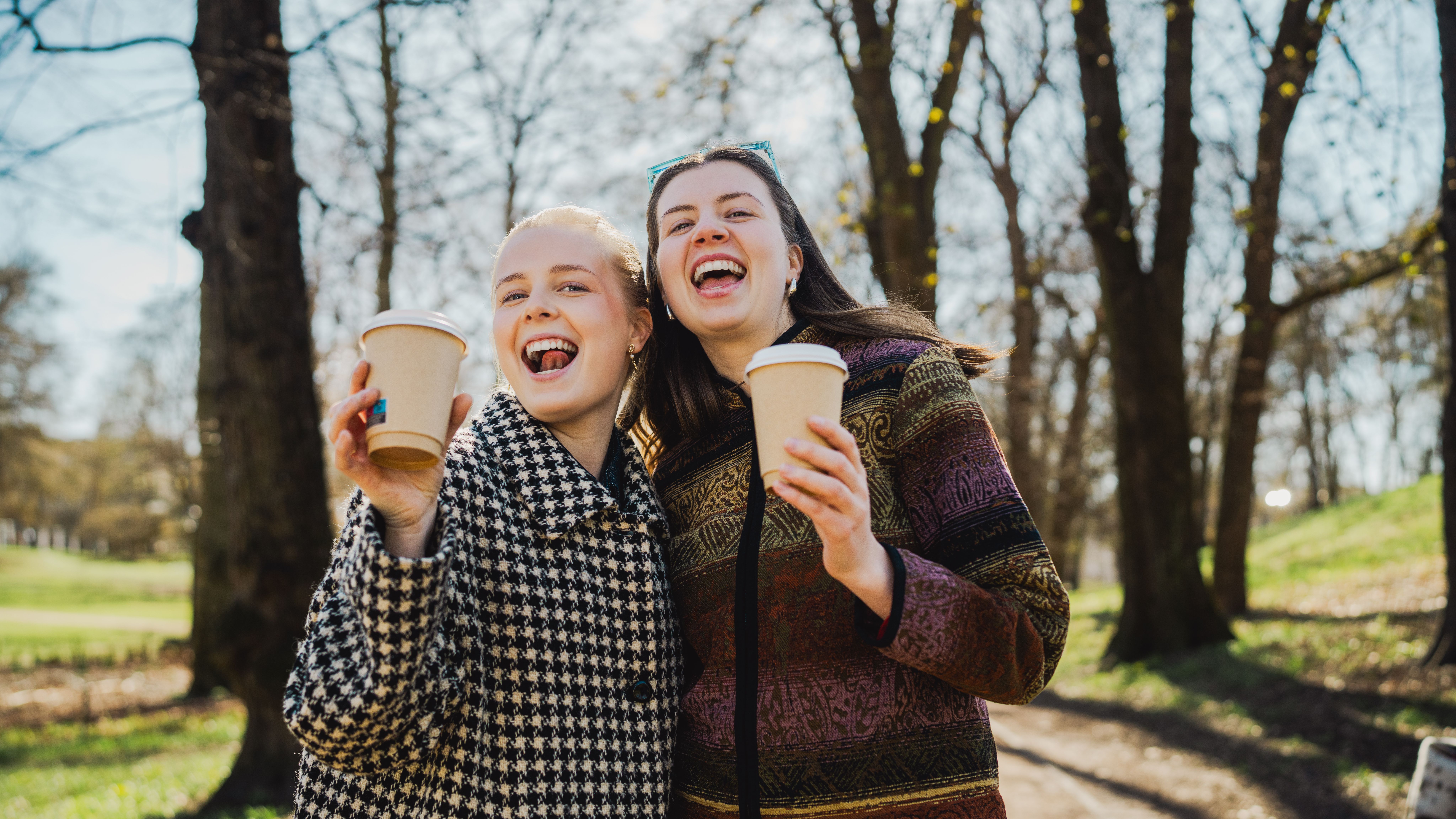 Two girls drinking coffee